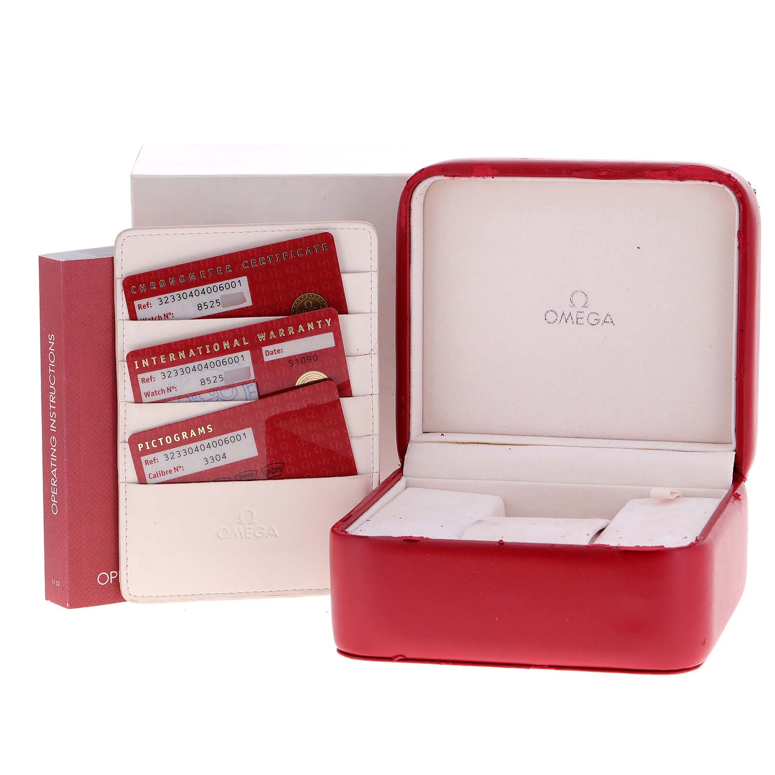 The image shows the box, warranty cards, and operating instructions for an Omega Speedmaster 323.30.40.40.06.001 Men's Stainless Steel Grey Dial 323.30.40.40.06.001 Men's Stainless Steel Grey Dial watch.