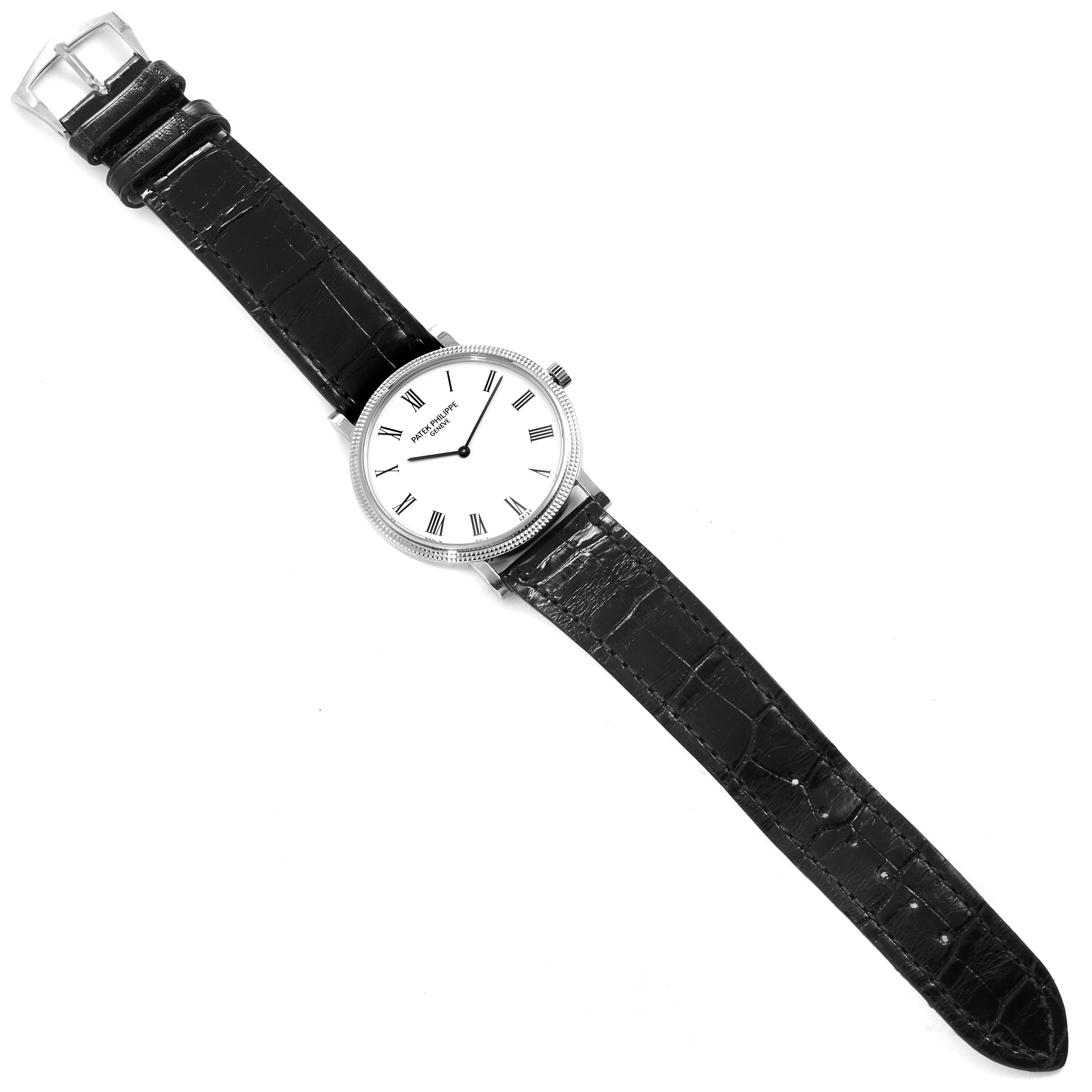 The image shows a Patek Philippe Calatrava 5120G Men's White Gold White Dial 5120G Men's White Gold White Dial watch from a top view with its face, strap, and buckle visible.