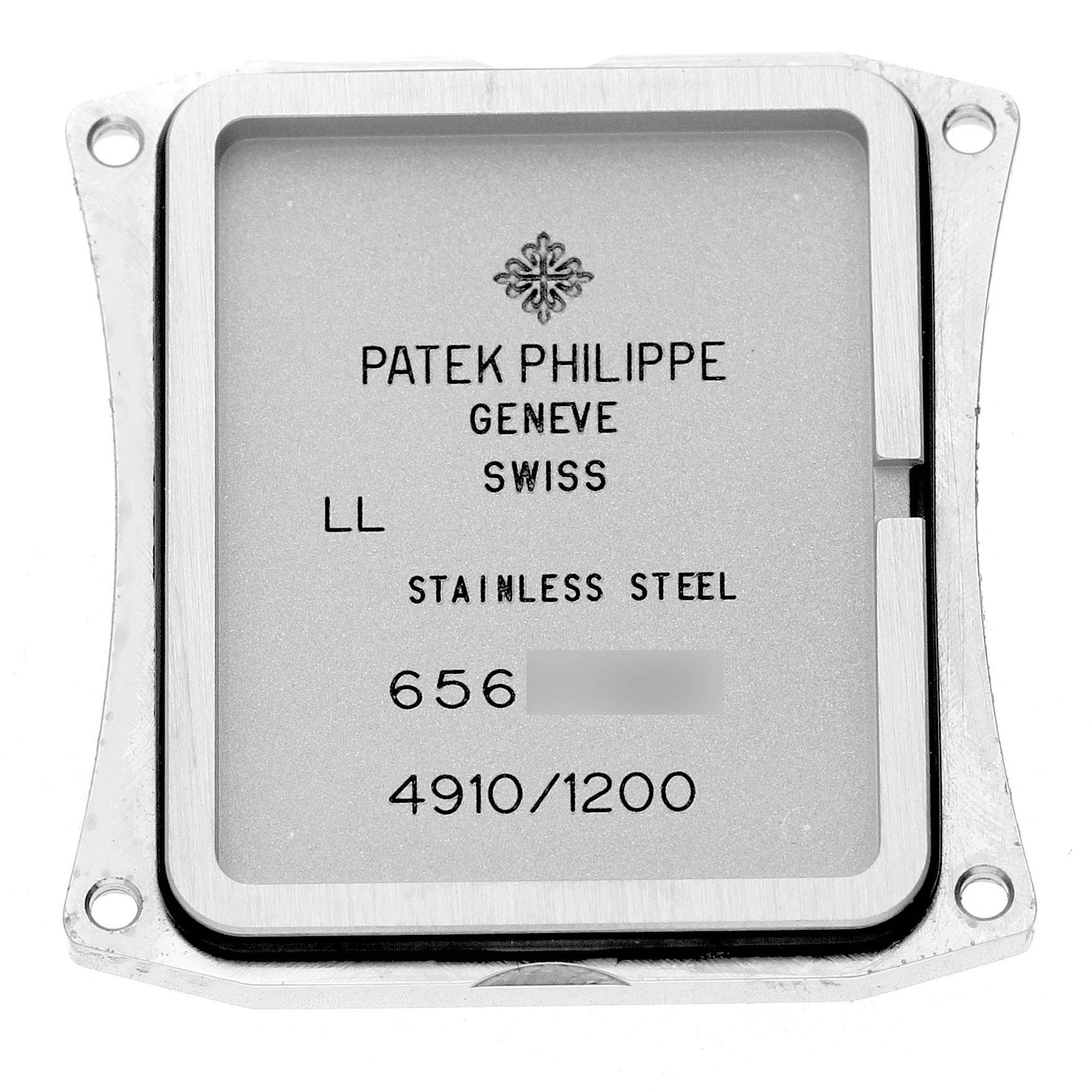 The image shows the backplate of a Patek Philippe Twenty-4 4910A Women's Stainless Steel Green Dial watch, highlighting the engraved details and material.