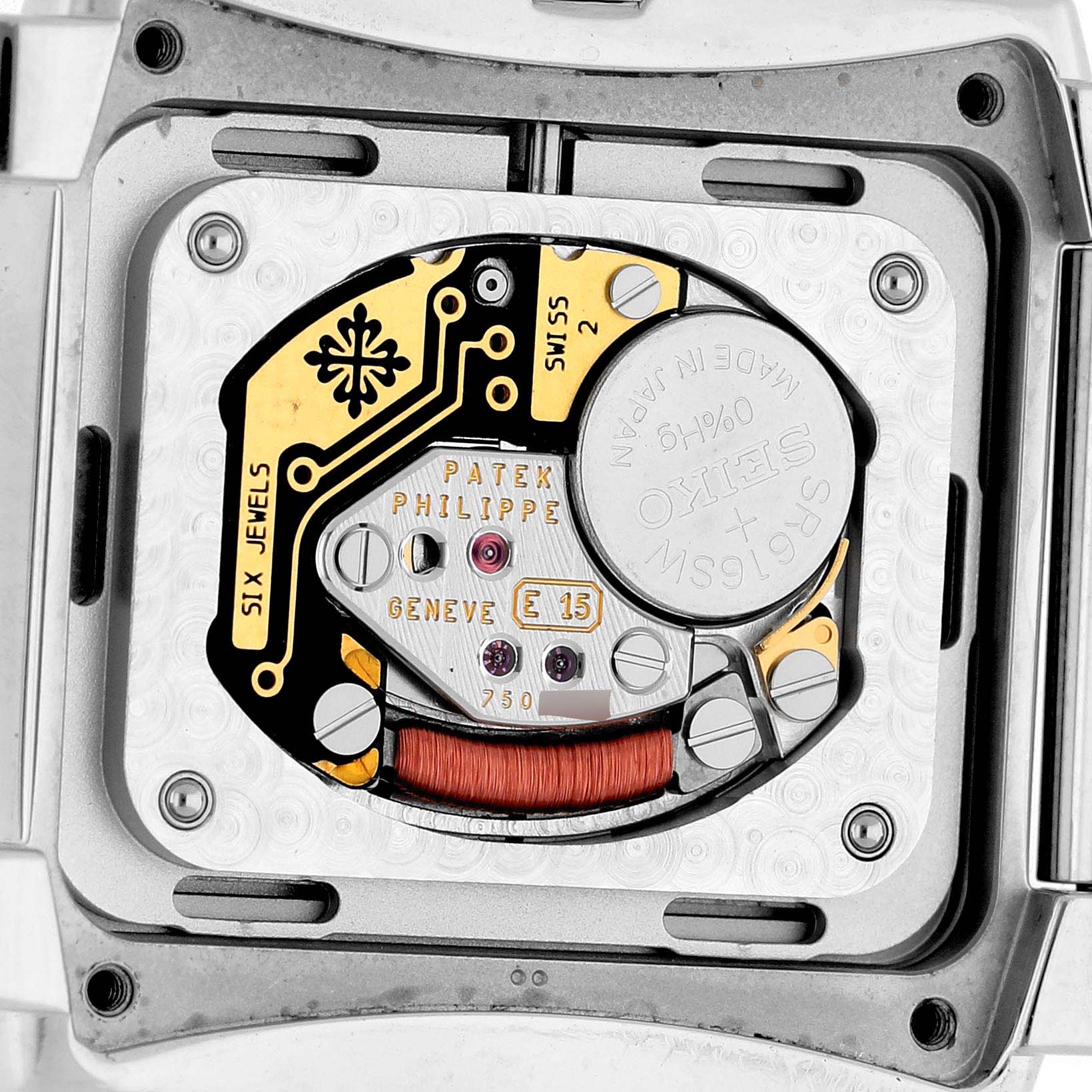 The image shows the intricate movement and inner mechanism of a Patek Philippe Twenty-4 4910A Women's Stainless Steel Green Dial watch.