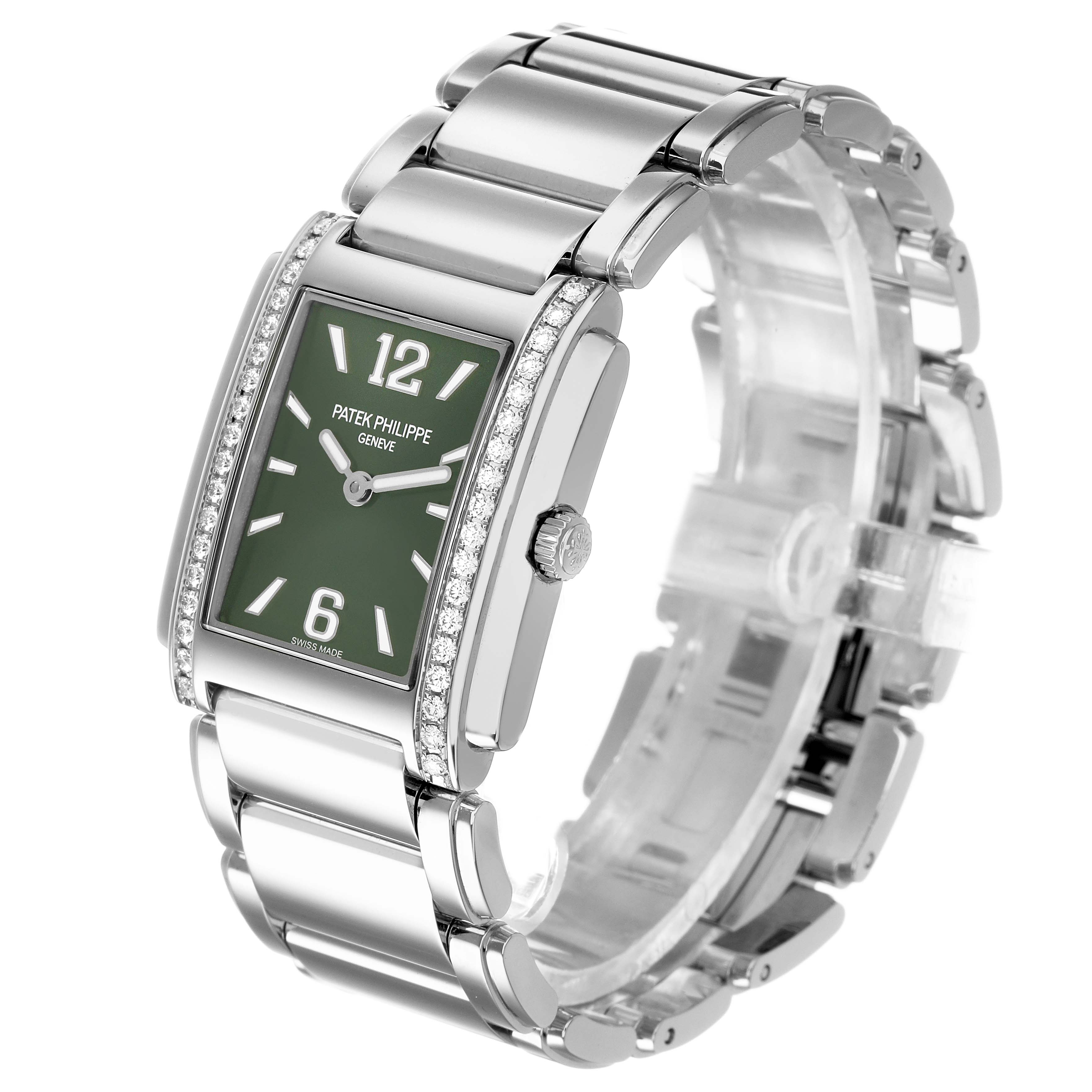 The Patek Philippe Twenty-4 4910A Women's Stainless Steel Green Dial watch is shown at a three-quarter angle, highlighting its green dial, diamond-set bezel, and metal bracelet.