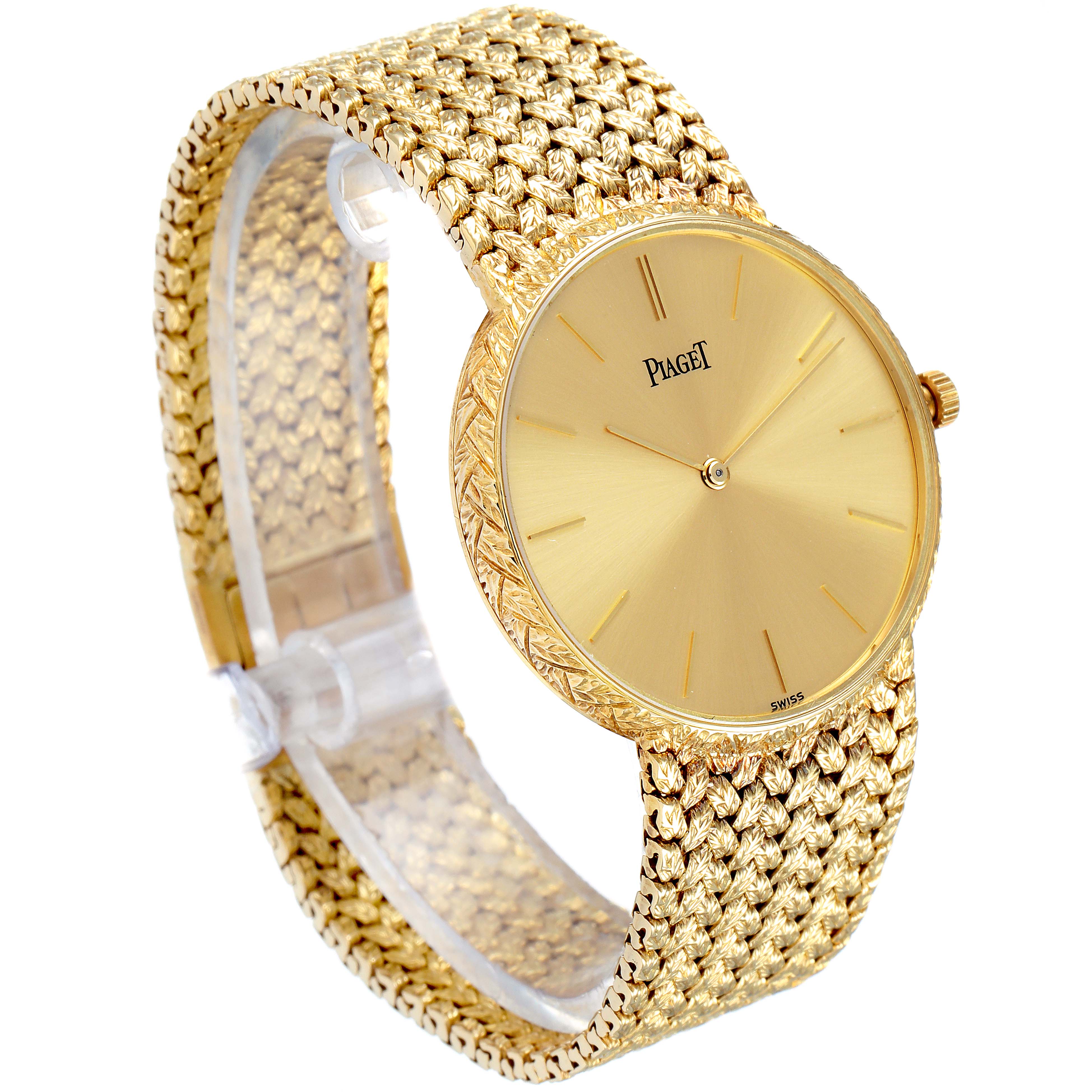 The Piaget 9065 ND 2 Men's Yellow Gold Champagne Dial 9065 ND 2 Men's Yellow Gold Champagne Dial 9065 model watch is shown at an angle displaying its face, woven gold bracelet, and side profile.