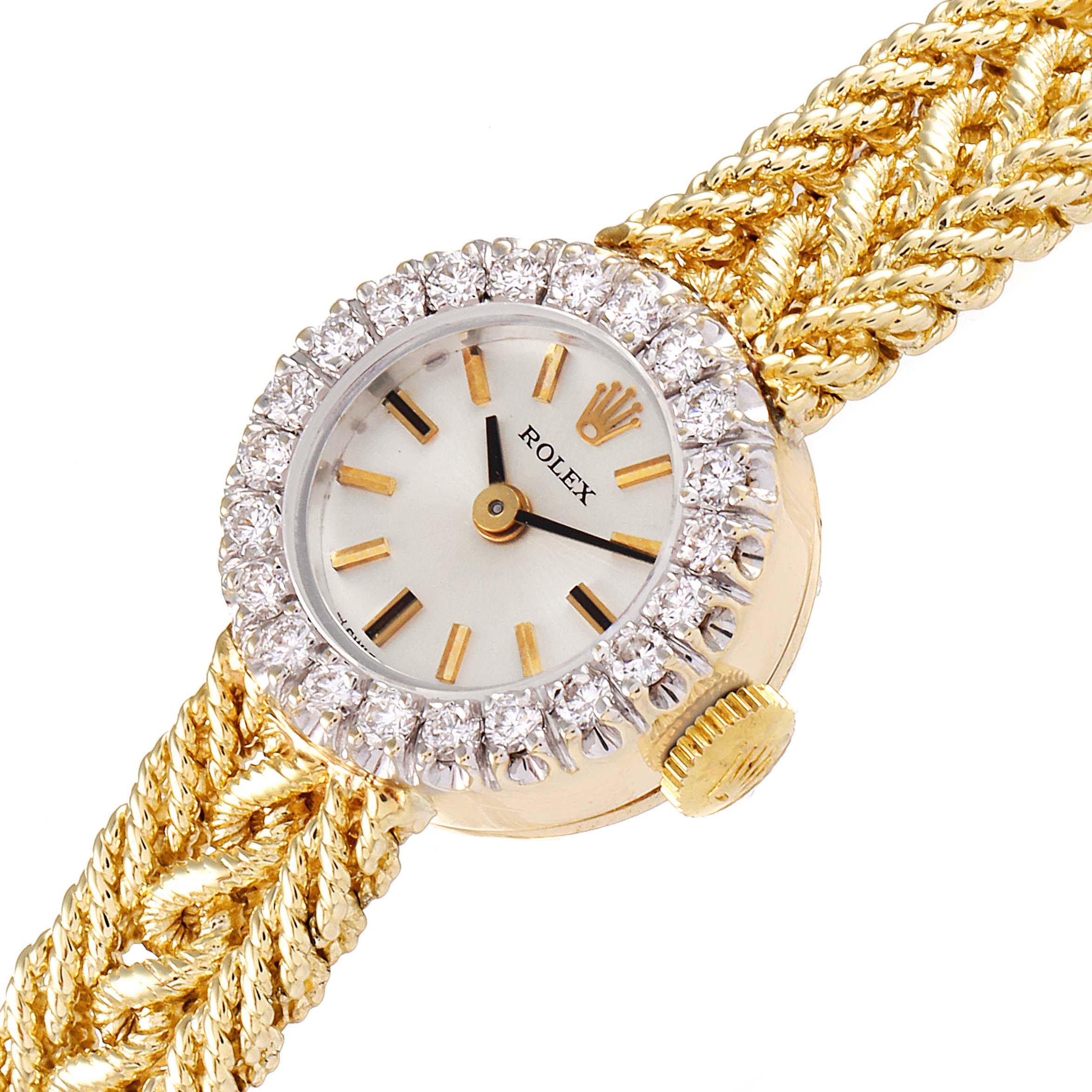 This image shows a close-up of the Rolex Cocktail 32369 Women's Yellow Gold Silver Dial 32369 Women's Yellow Gold Silver Dial model watch face, crown, and part of its intricately woven band.