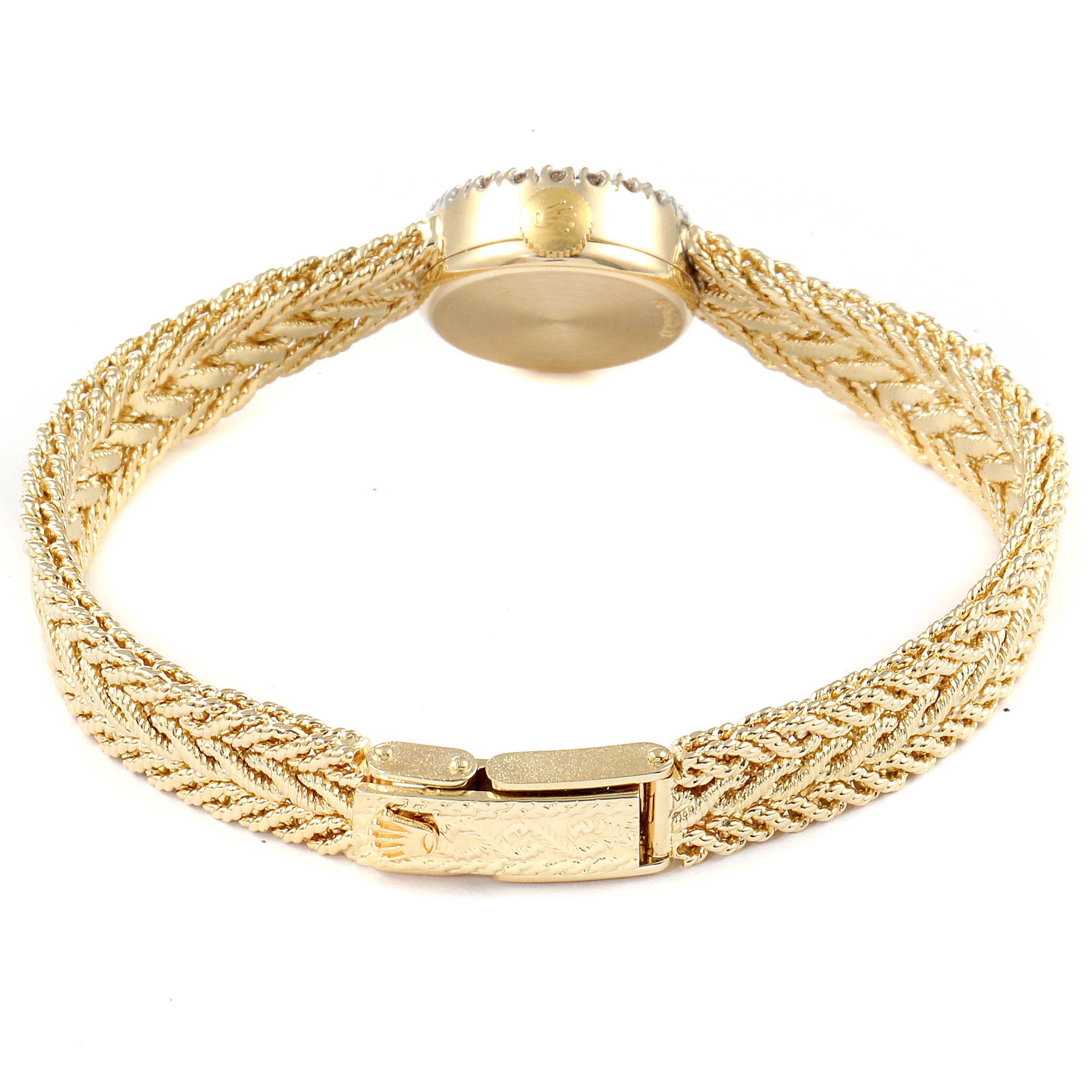 The image shows a Rolex Cocktail 32369 Women's Yellow Gold Silver Dial 32369 Women's Yellow Gold Silver Dial model watch from the back, highlighting its intricate gold bracelet and clasp.