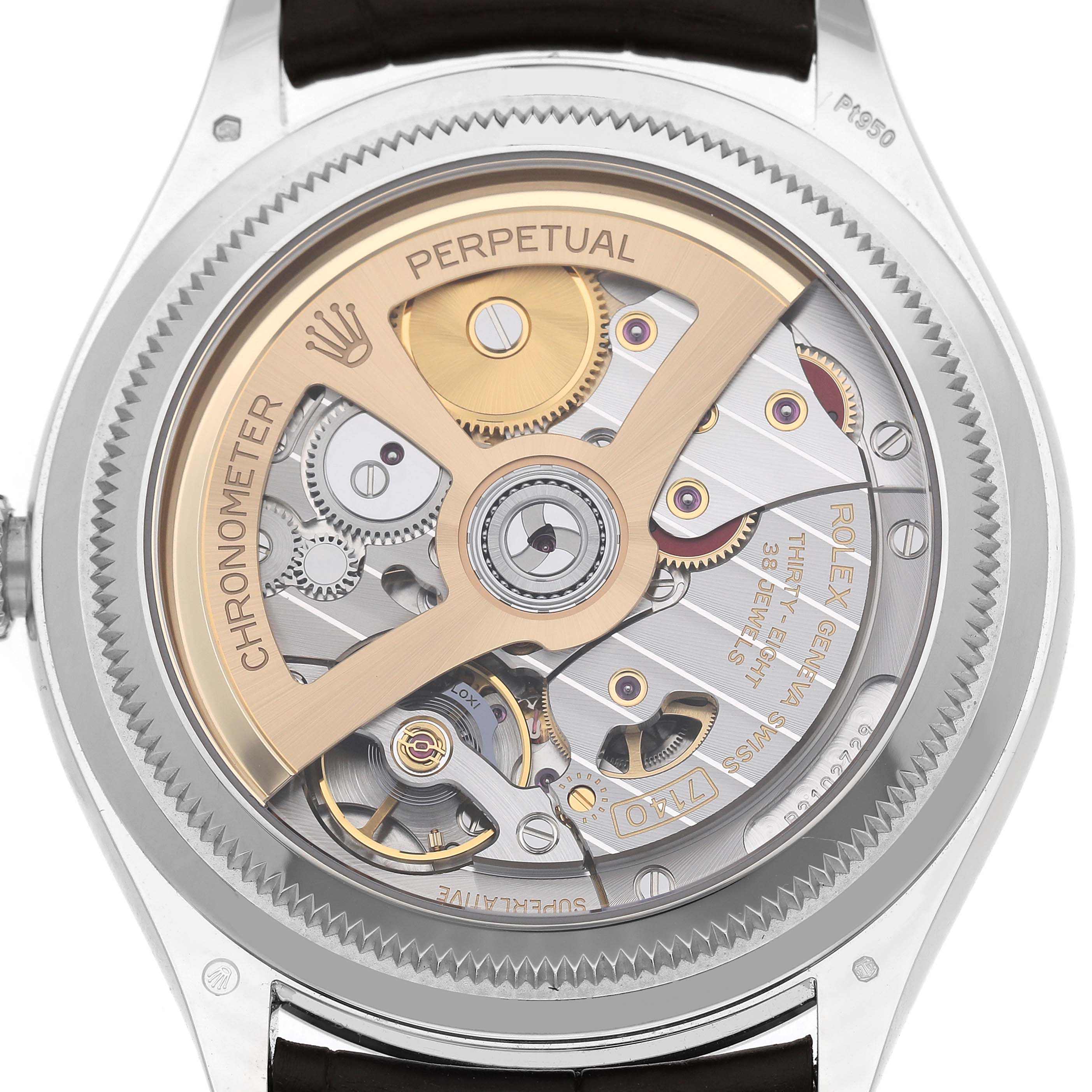 The image shows the back view of a Rolex 1908 52506 Men's Platinum Blue Dial model, highlighting its intricate mechanical movement and rotor.
