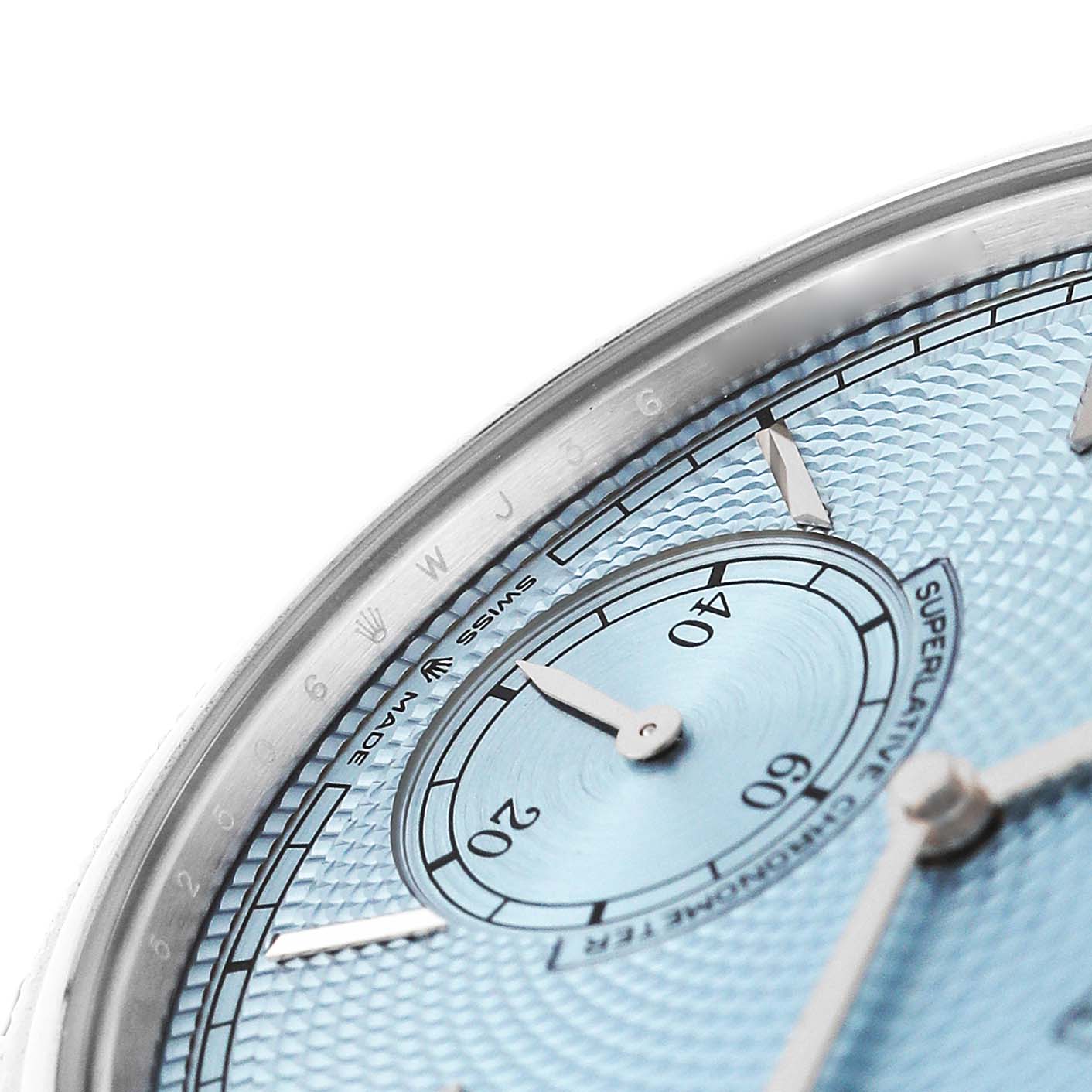 The image shows a close-up of the Rolex 1908 52506 Men's Platinum Blue Dial's dial, highlighting the textured blue surface, indices, and subdial.