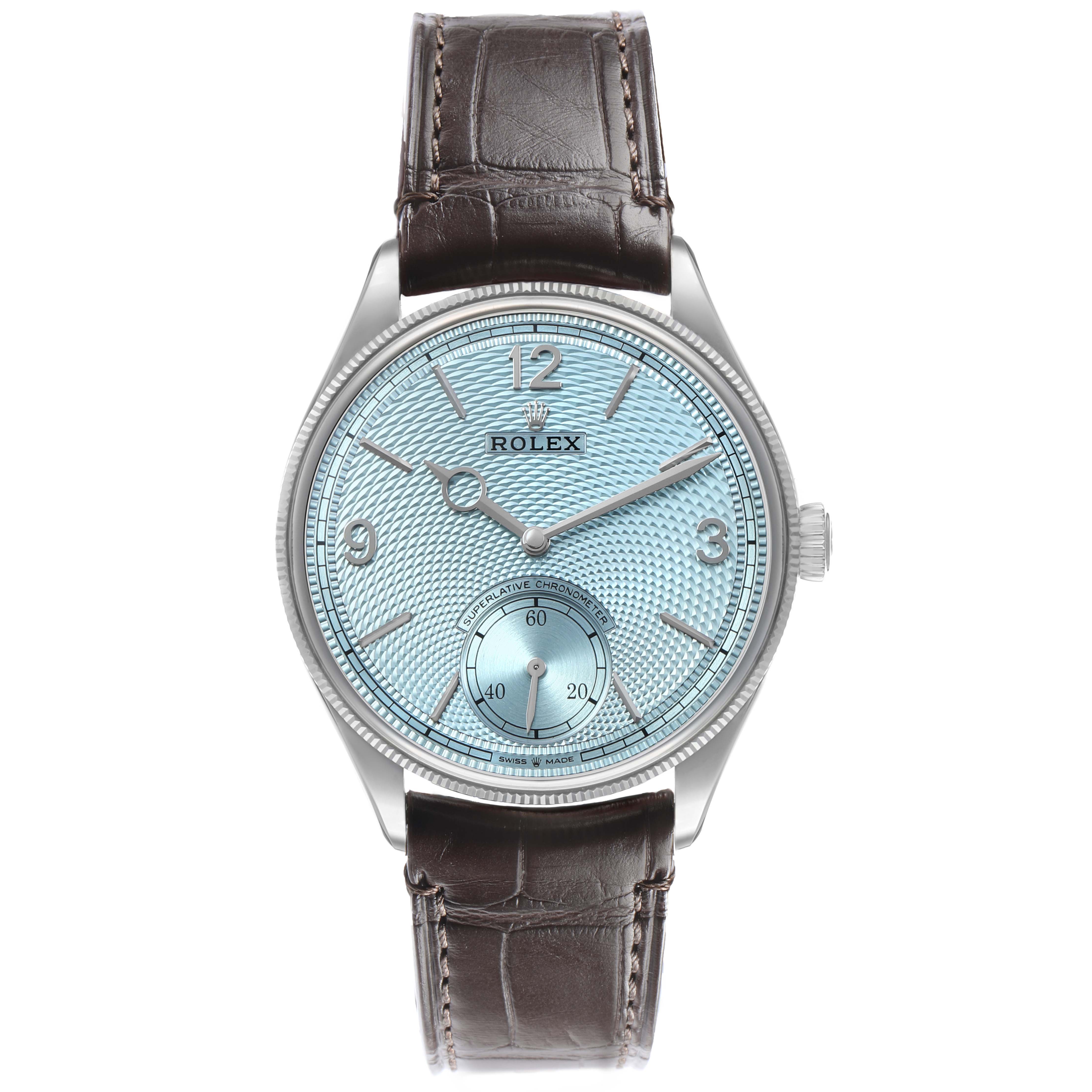 The Rolex 1908 52506 Men's Platinum Blue Dial model watch is shown from the front, displaying its dial, hands, crown, and leather strap.