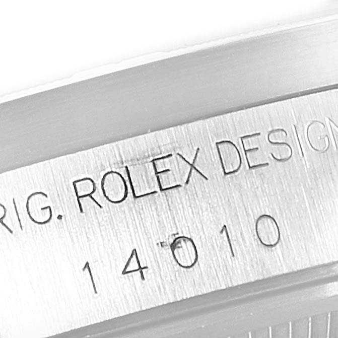 This image shows an angled close-up of the casing detail on a Rolex Air-King 14010 Men's Stainless Steel Blue Dial 14010 Men's Stainless Steel Blue Dial watch, specifically the engraved model and brand name.