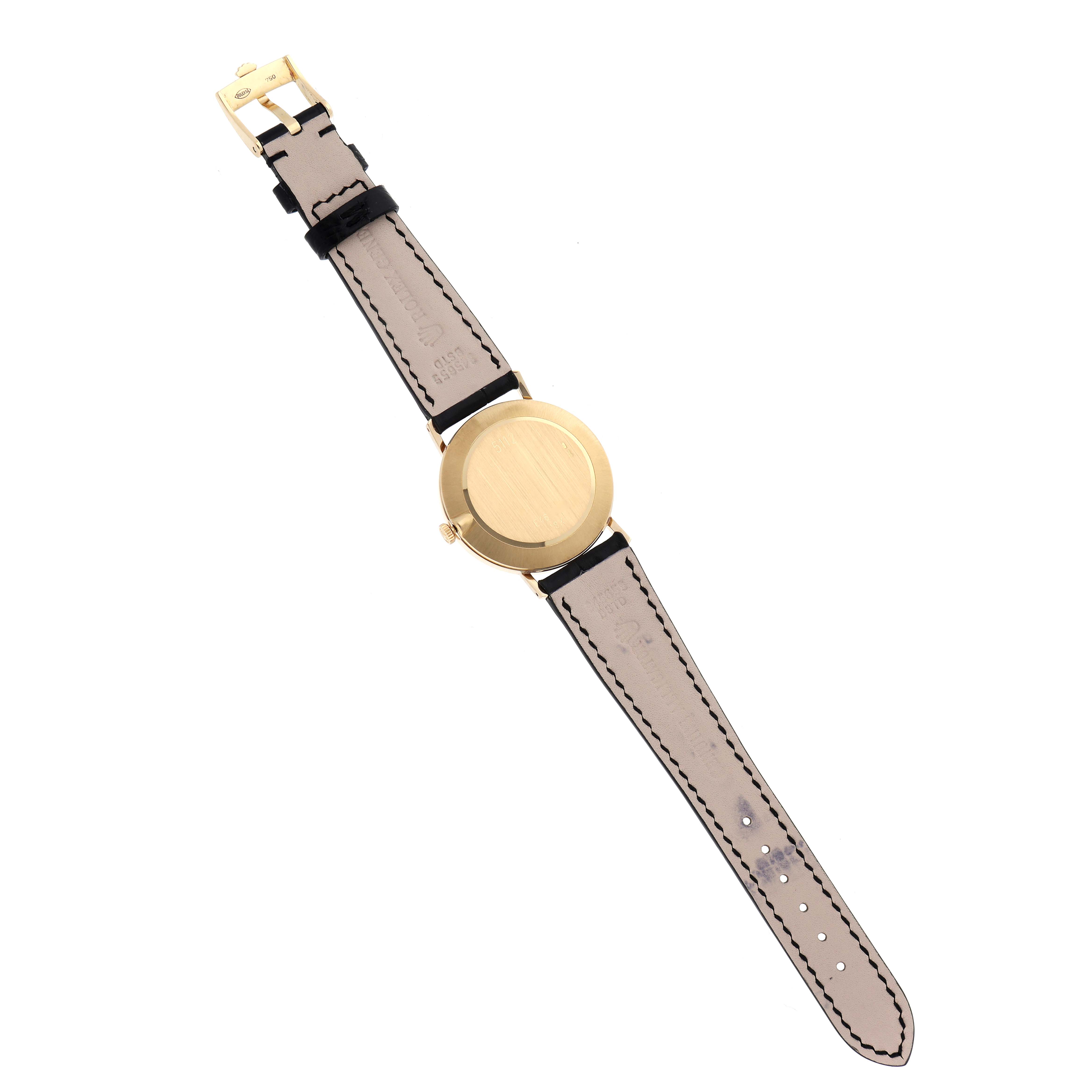 The image shows the back view of a Rolex Cellini 5112 Men
s Yellow Gold White Dial 5112 Men
s Yellow Gold White Dial watch, highlighting the case and leather strap.