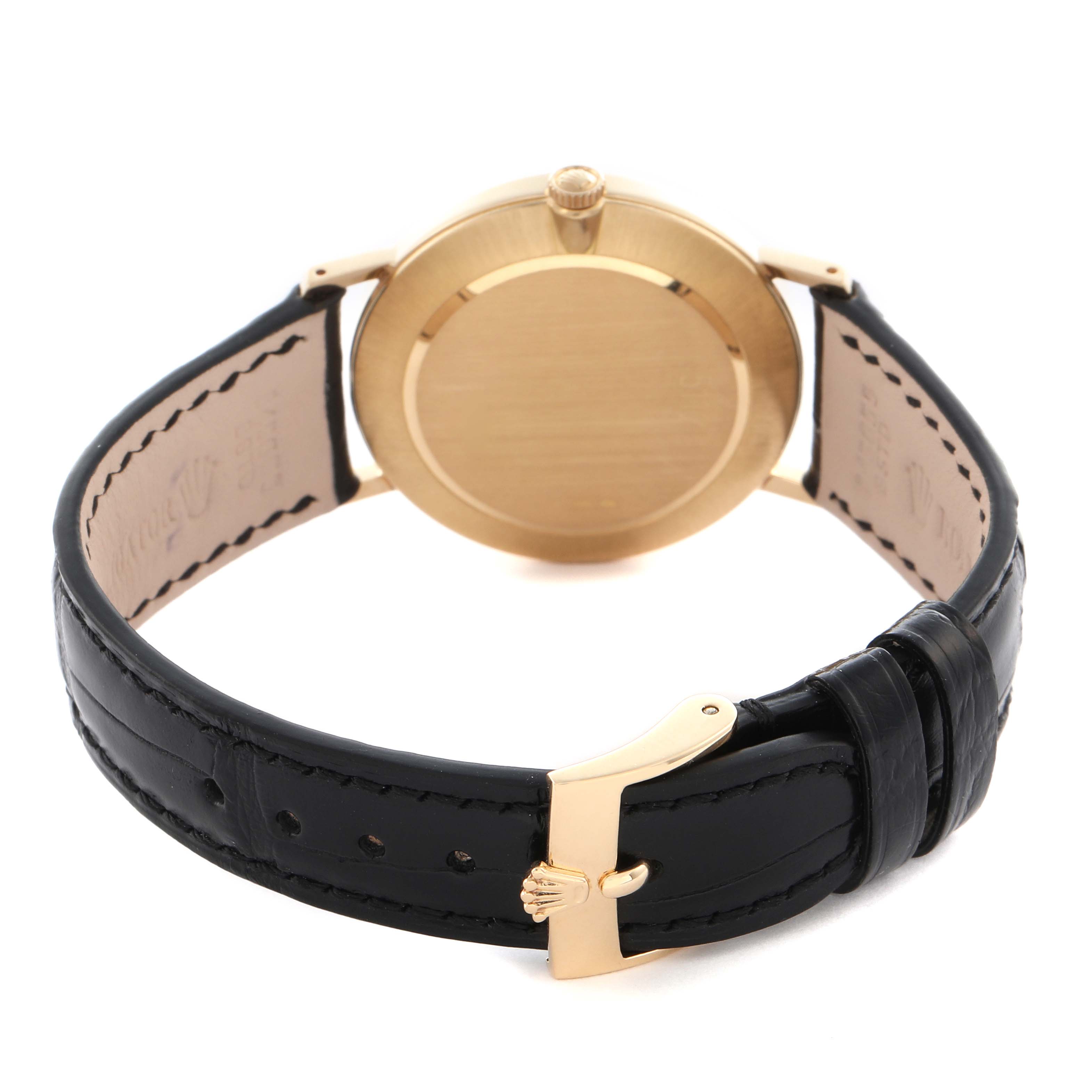 The Rolex Cellini 5112 Men
s Yellow Gold White Dial 5112 Men
s Yellow Gold White Dial watch is shown from the back, highlighting the caseback, strap, and clasp.