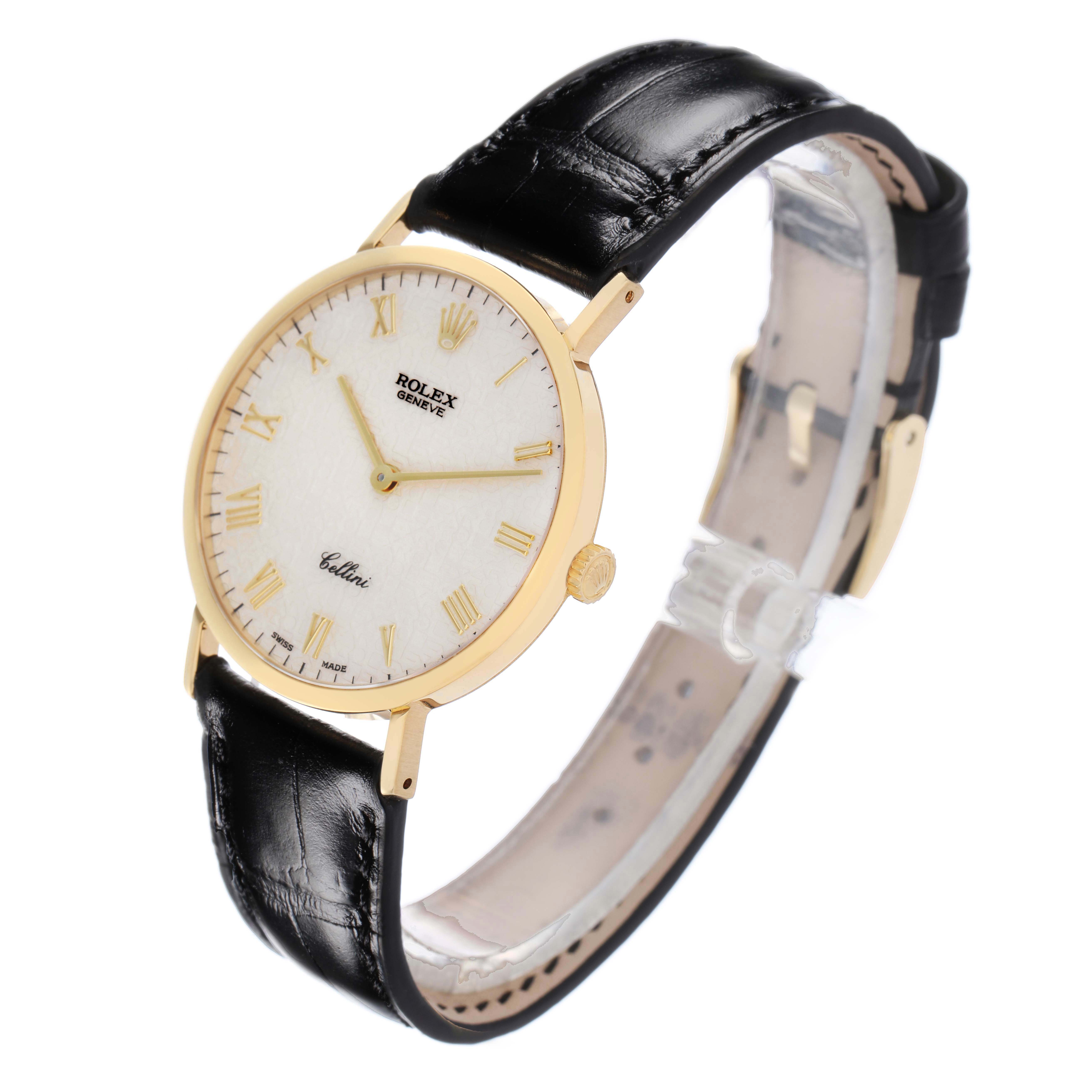 The Rolex Cellini 5112 Men
s Yellow Gold White Dial 5112 Men
s Yellow Gold White Dial watch is shown at a three-quarter angle, displaying the face, bezel, case, and black leather strap.