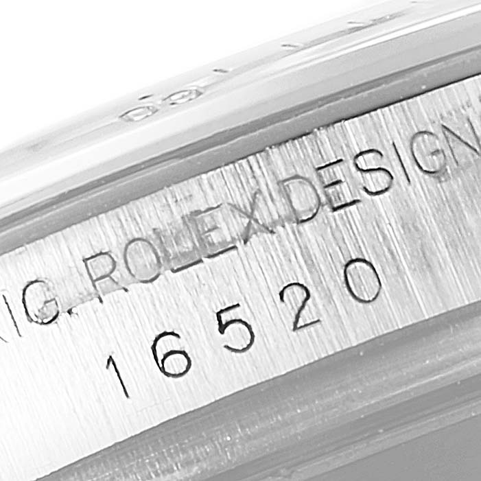 The image shows a close-up of the case side of a Rolex Daytona 16520 Men
s Stainless Steel Black Dial 16520 Men
s Stainless Steel Black Dial watch, displaying the model number "16520".