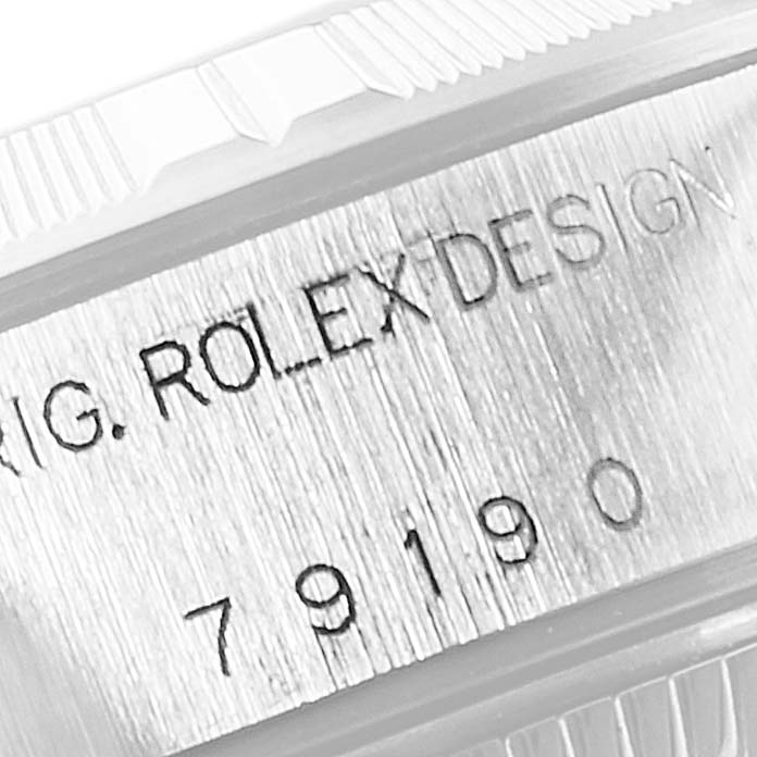This image shows a close-up of the model number engraving on the side of a Rolex Date 79190 Women's Stainless Steel Black Dial 79190 Women's Stainless Steel Black Dial watch case.