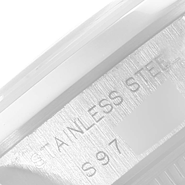 This close-up image shows the "Stainless Steel" marking on the side case of a Rolex Date 69160 Women's Stainless Steel Blue Dial 69160 Women's Stainless Steel Blue Dial model.