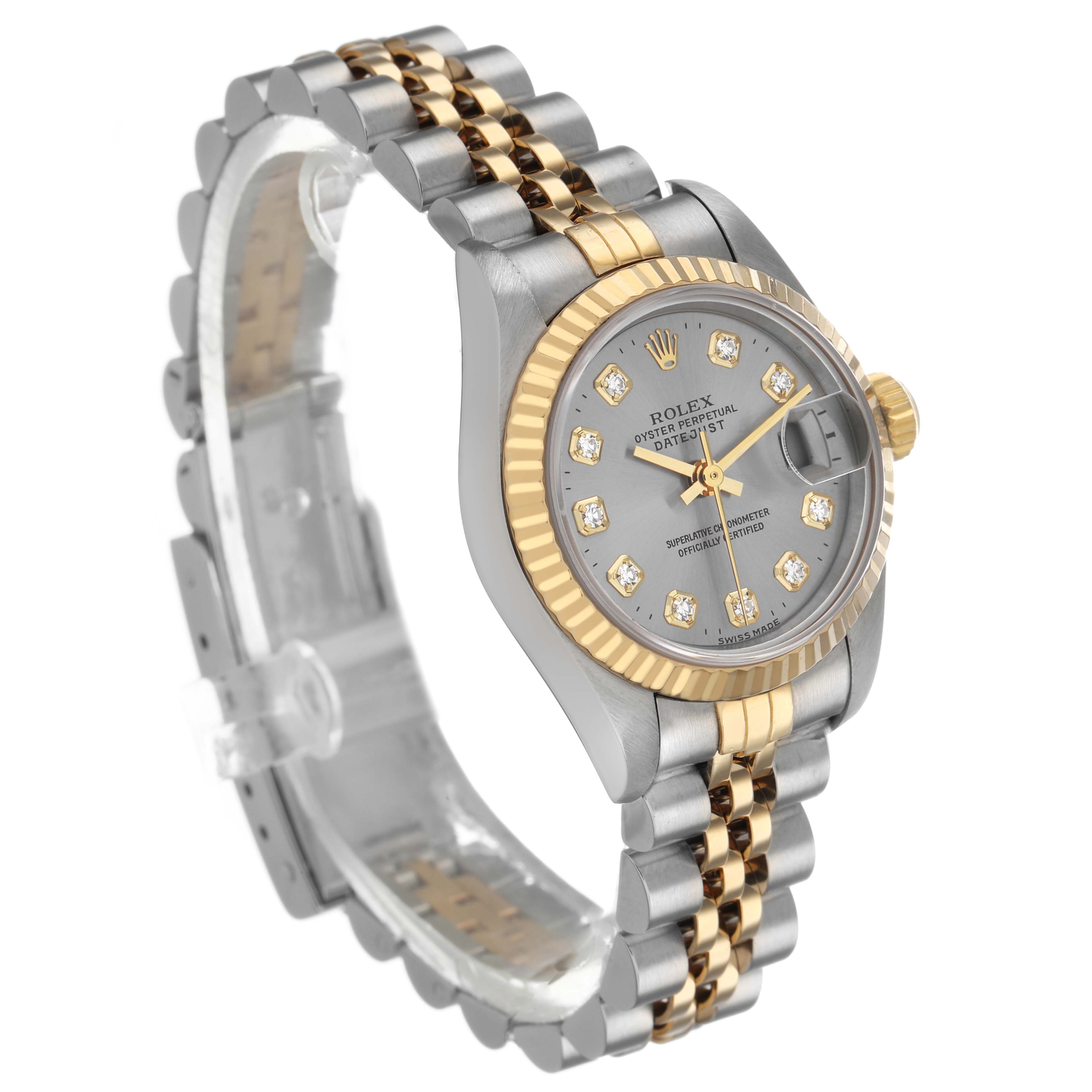 The Rolex Datejust 69173 Women's Steel and Gold (two tone) Silver Dial watch is shown from a three-quarter angle, highlighting its two-tone bracelet, fluted bezel, and diamond hour markers.
