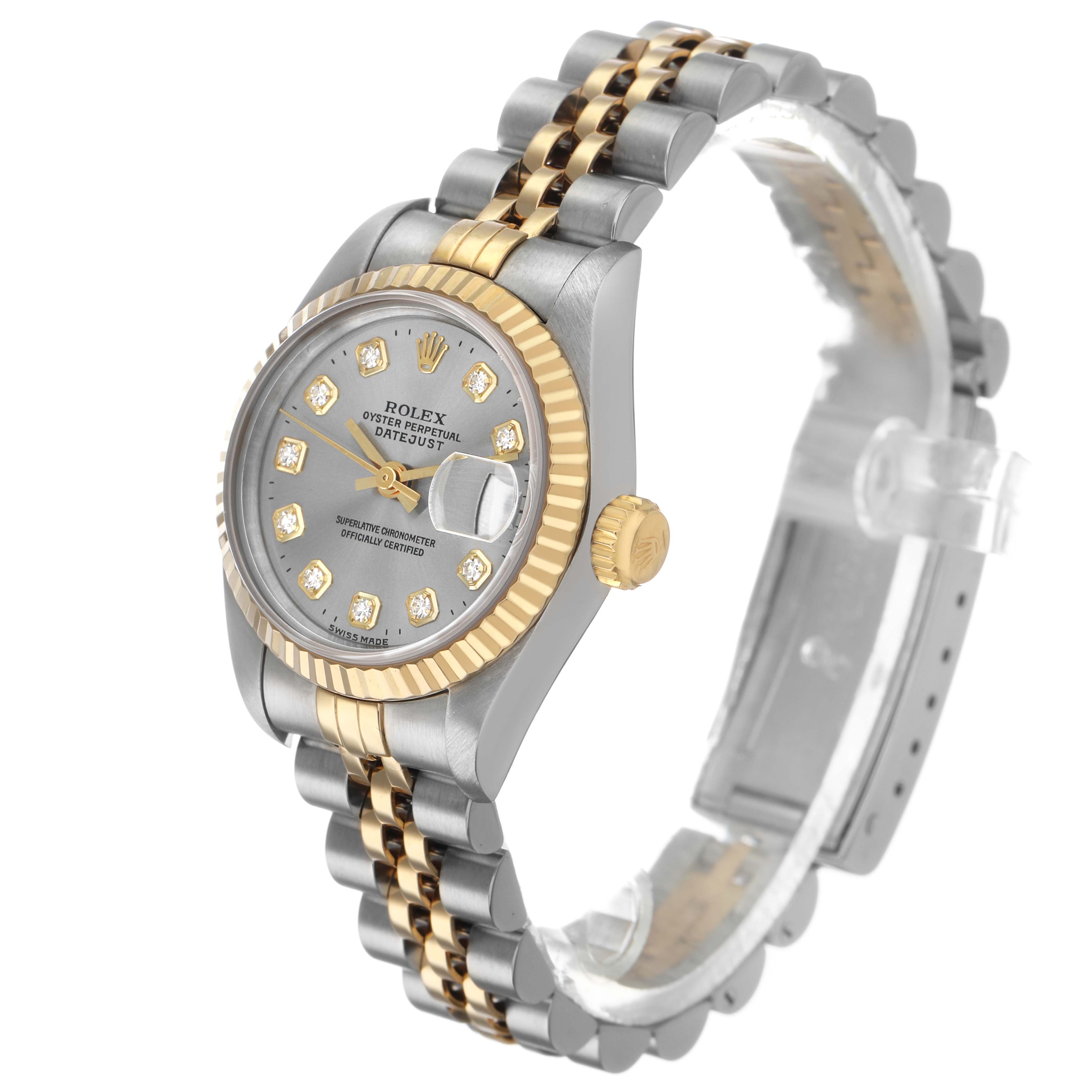 The Rolex Datejust 69173 Women's Steel and Gold (two tone) Silver Dial watch is shown at a side angle, highlighting its two-tone bracelet, fluted bezel, and diamond markers on the dial.
