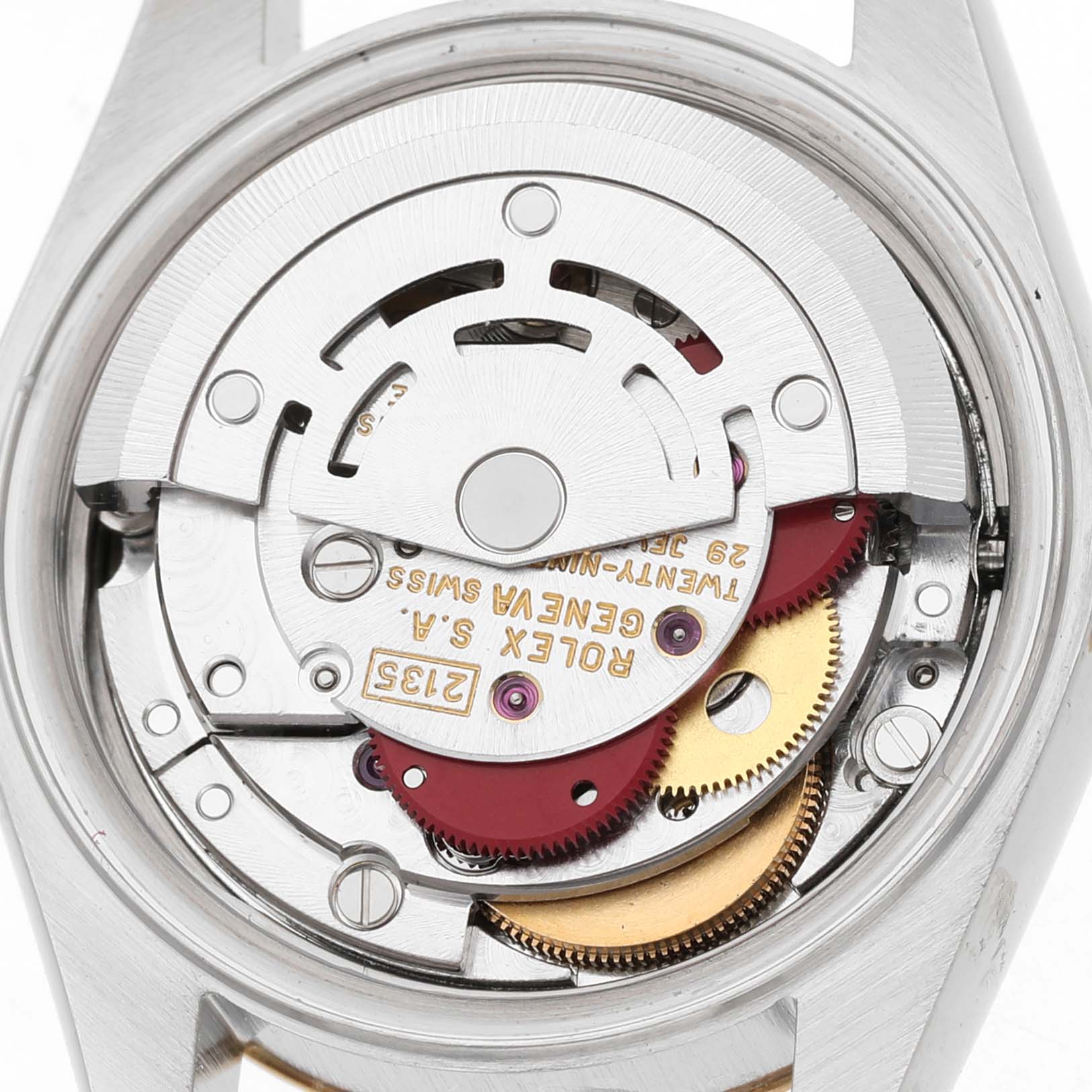 The image shows the movement of a Rolex Datejust 69173 Women's Steel and Gold (two tone) Silver Dial from a top-down angle, highlighting its intricate gears and components.