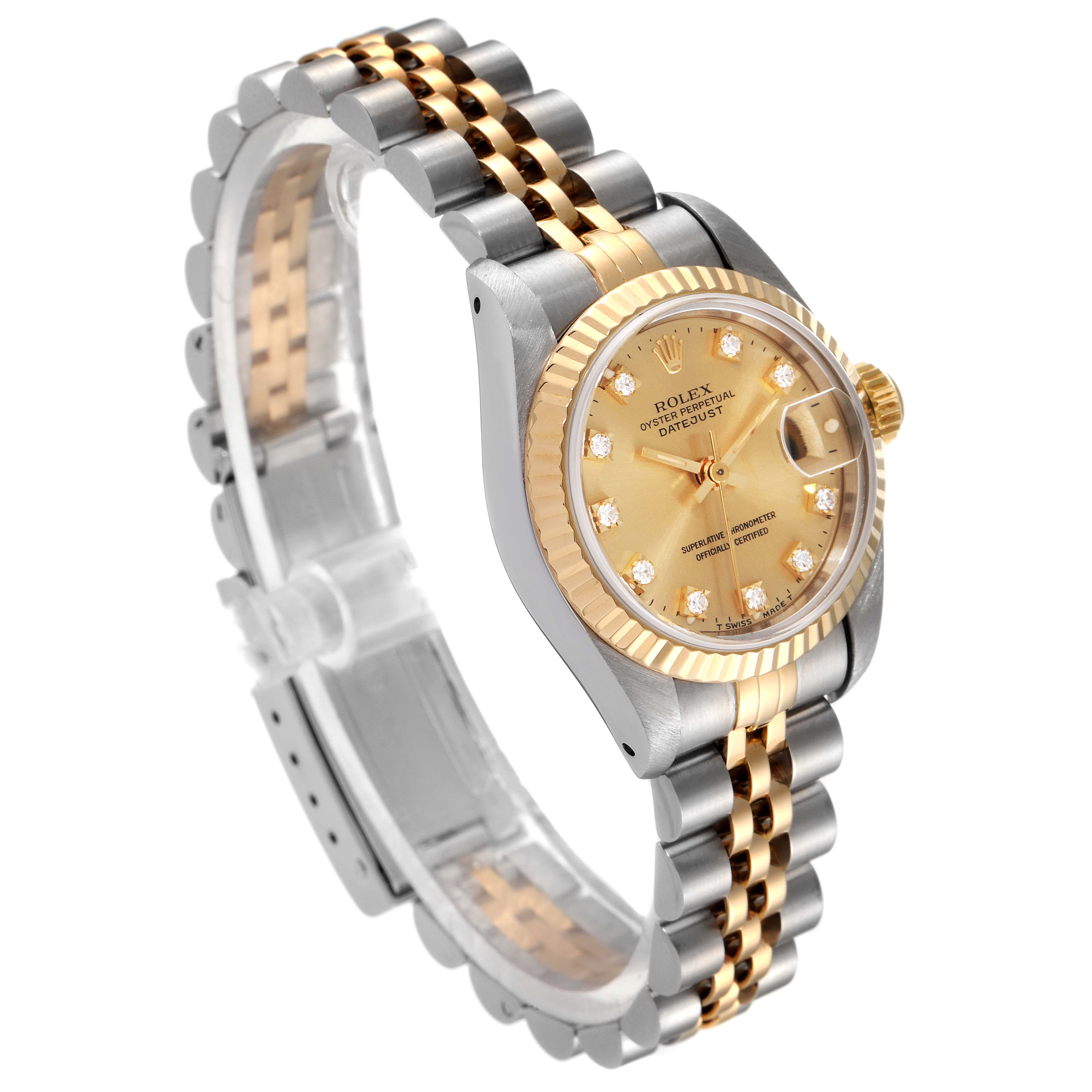 The Rolex Datejust 69173 Women
s Steel and Gold (two tone) Champagne Dial 69173 Women
s Steel and Gold (two tone) Champagne Dial watch is shown at an angle displaying its gold and silver case, bezel, bracelet, and champagne dial with diamond hour markers.