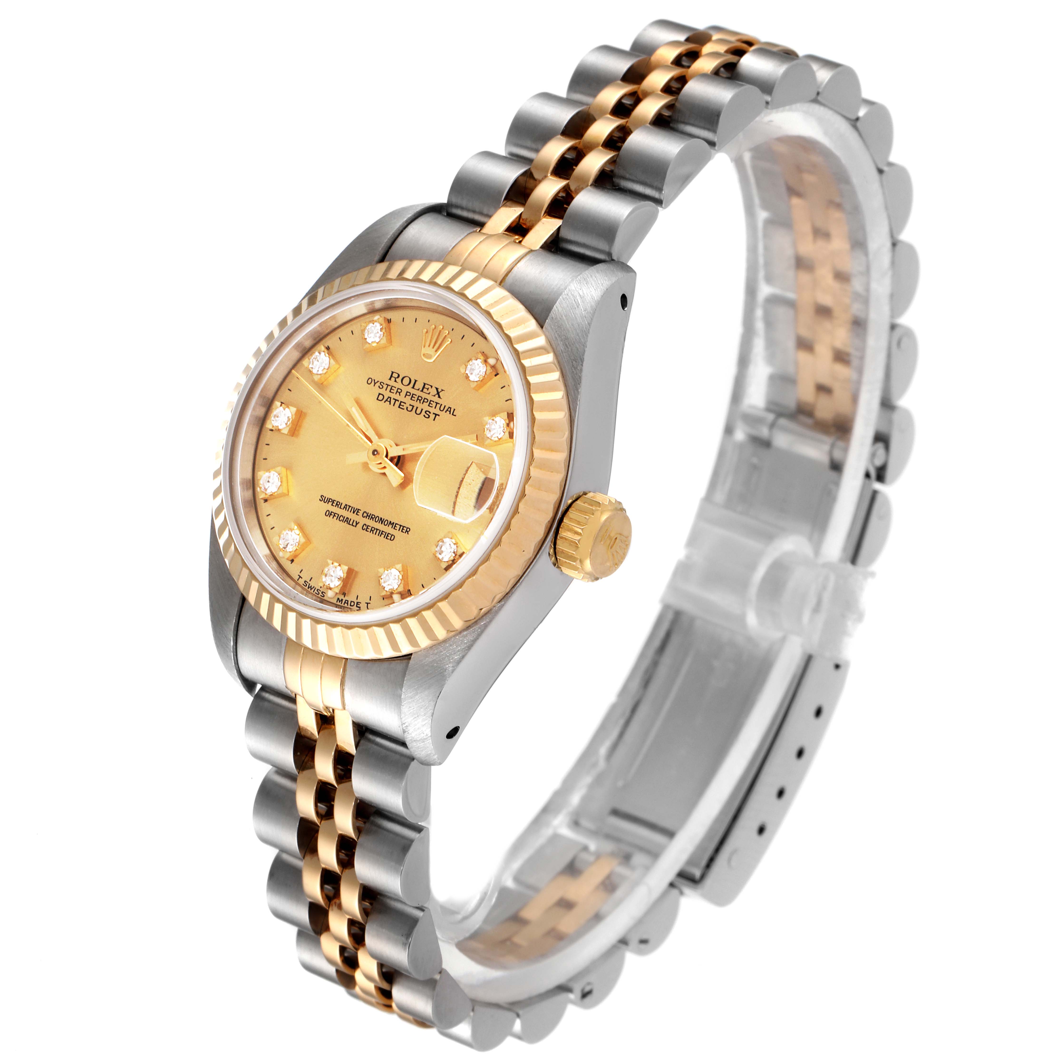 The image shows a side view of a Rolex Datejust 69173 Women
s Steel and Gold (two tone) Champagne Dial 69173 Women
s Steel and Gold (two tone) Champagne Dial watch, highlighting its gold and silver Jubilee bracelet and fluted bezel.