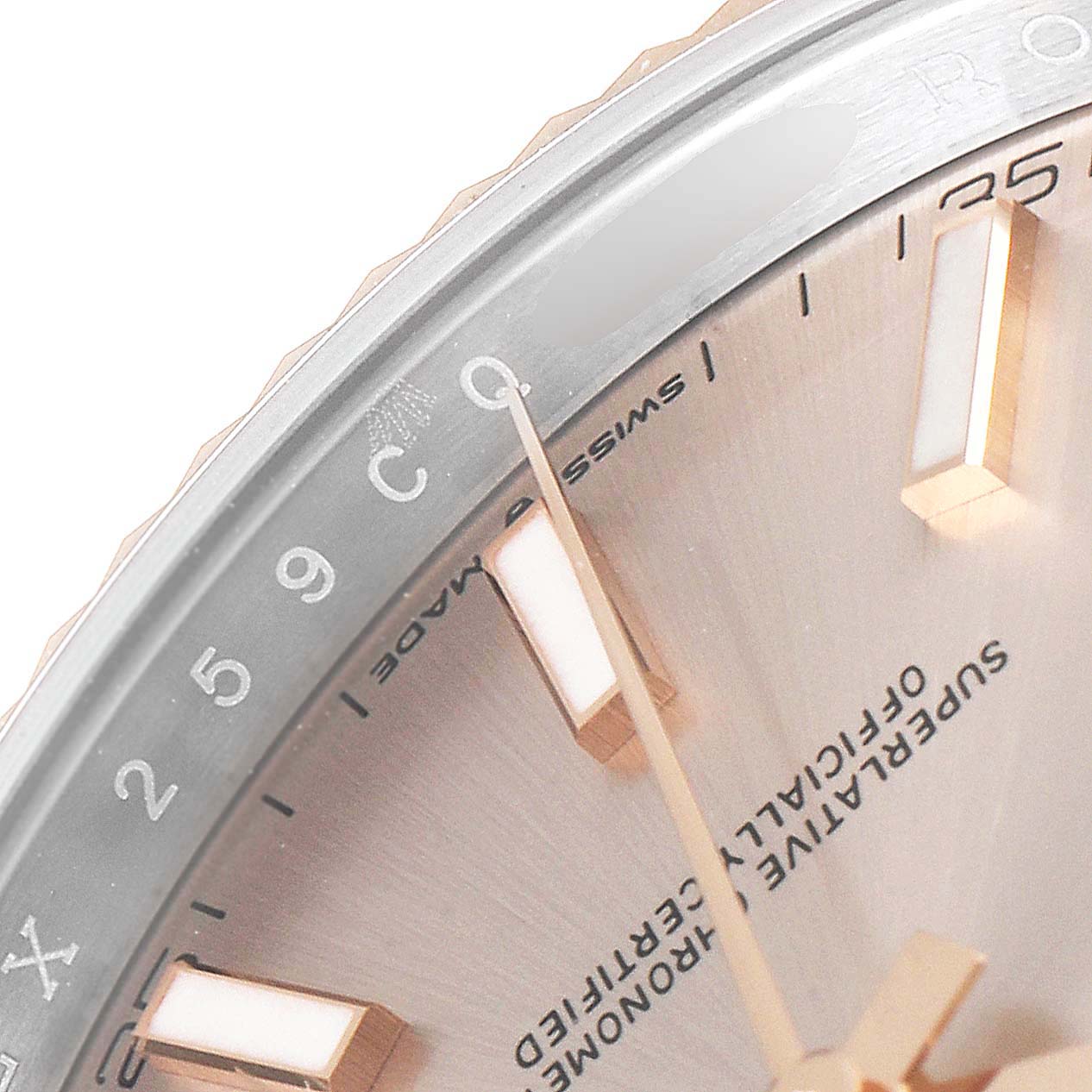 The image shows a partial close-up view of the dial and bezel of a Rolex Datejust 41 126331 Men's Steel and Gold (two tone) Beige Dial 126331 Men's Steel and Gold (two tone) Beige Dial watch.