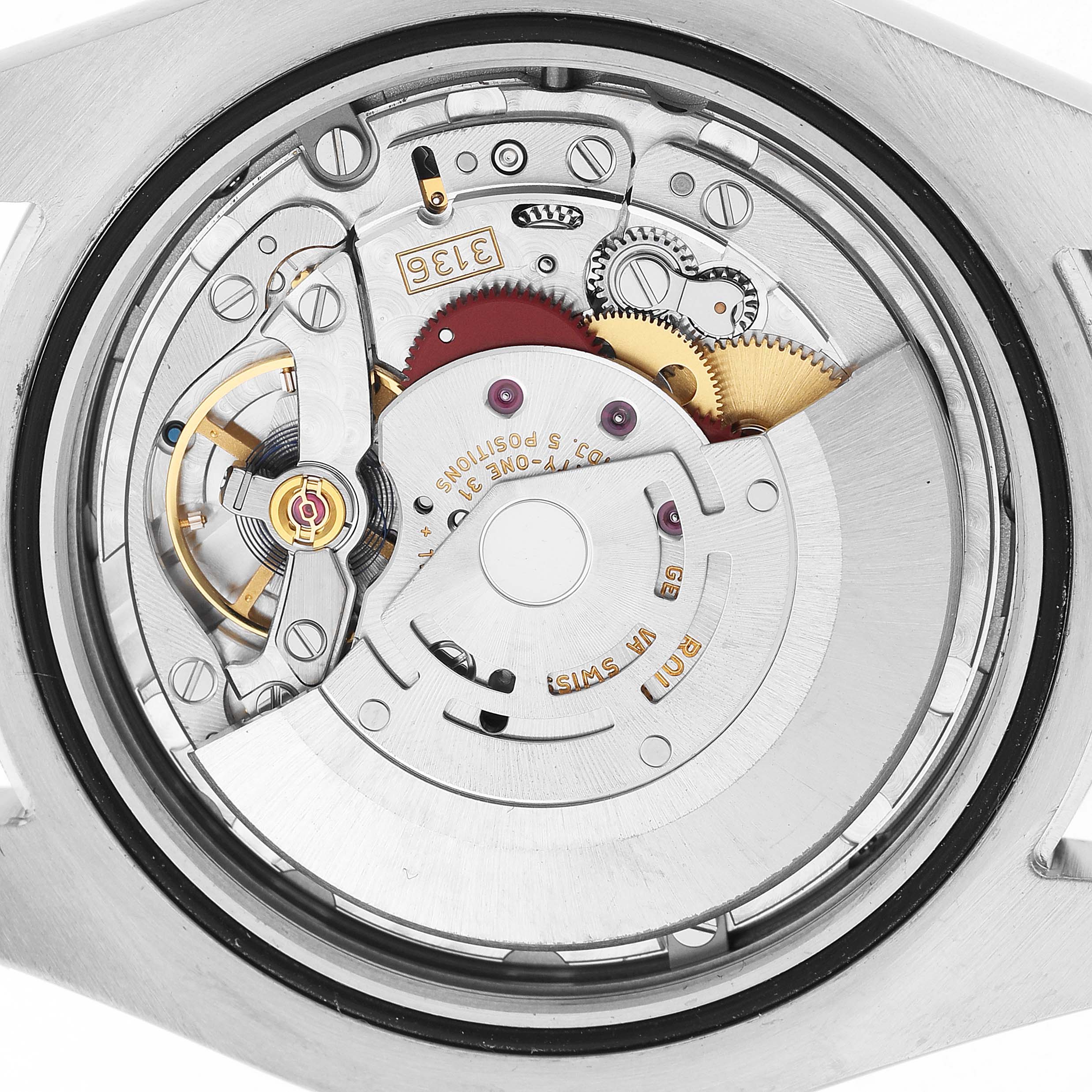 The image shows the movement mechanism of a Rolex Datejust 41 116334 Men's Stainless Steel Silver Dial, viewed from the back, highlighting gears and components.