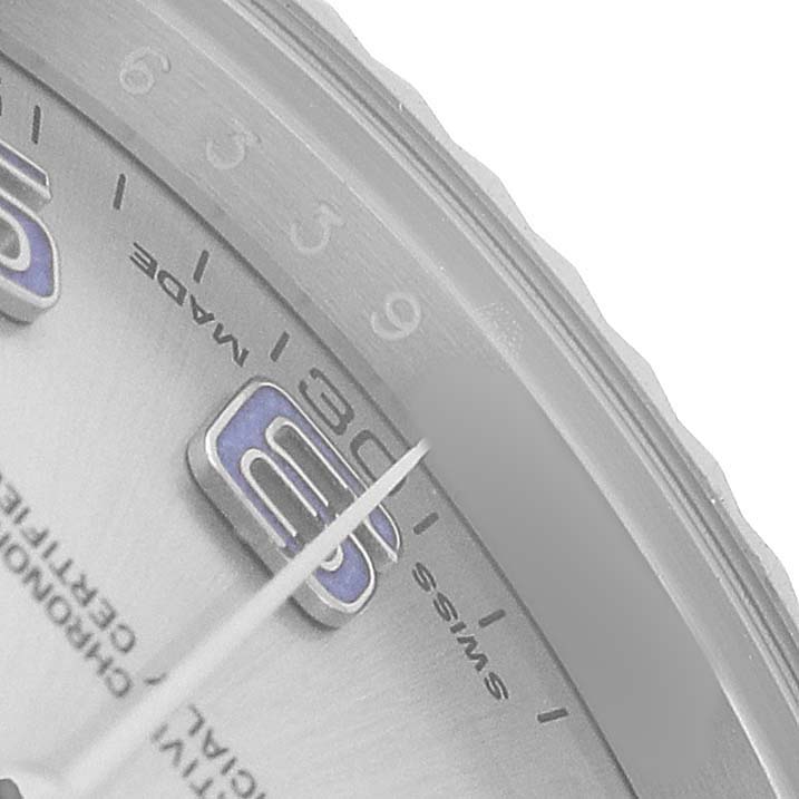 The image shows a close-up of the dial edge, minute markers, and part of the hands of the Rolex Datejust 41 116334 Men's Stainless Steel Silver Dial.