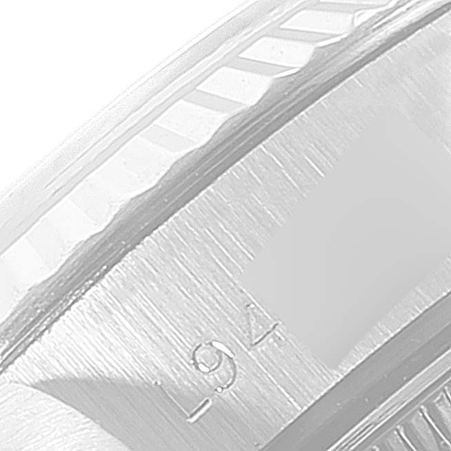 This image shows a close-up of the fluted bezel and part of the dial of a Rolex Datejust 69174 Women
s Stainless Steel Silver Dial 69174 Women
s Stainless Steel Silver Dial watch.