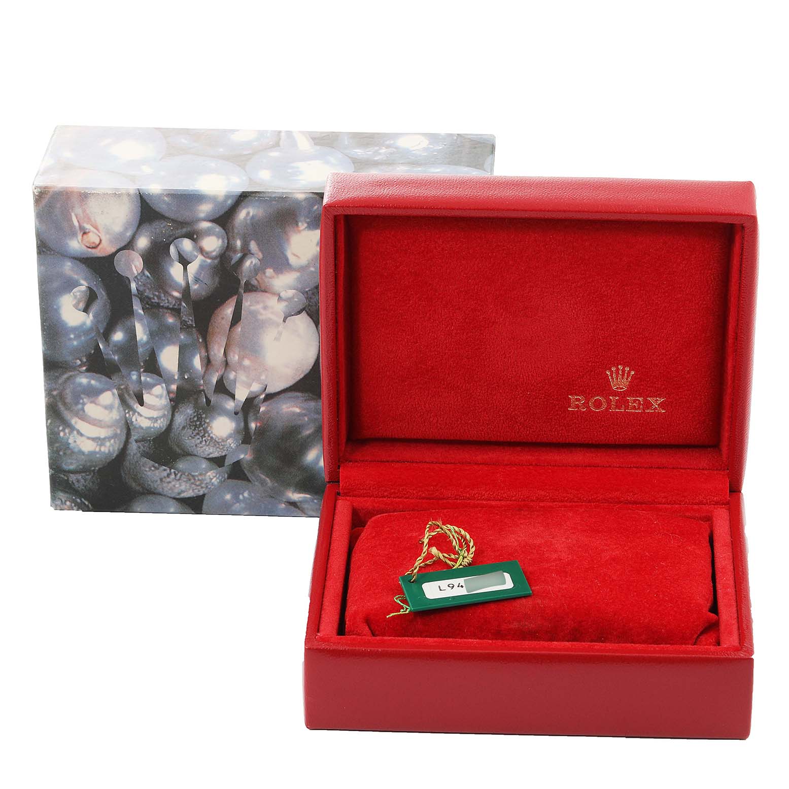 The image shows a Rolex Datejust 69174 Women
s Stainless Steel Silver Dial 69174 Women
s Stainless Steel Silver Dial watch box and packaging from a frontal angle, displaying the red interior with a tag.