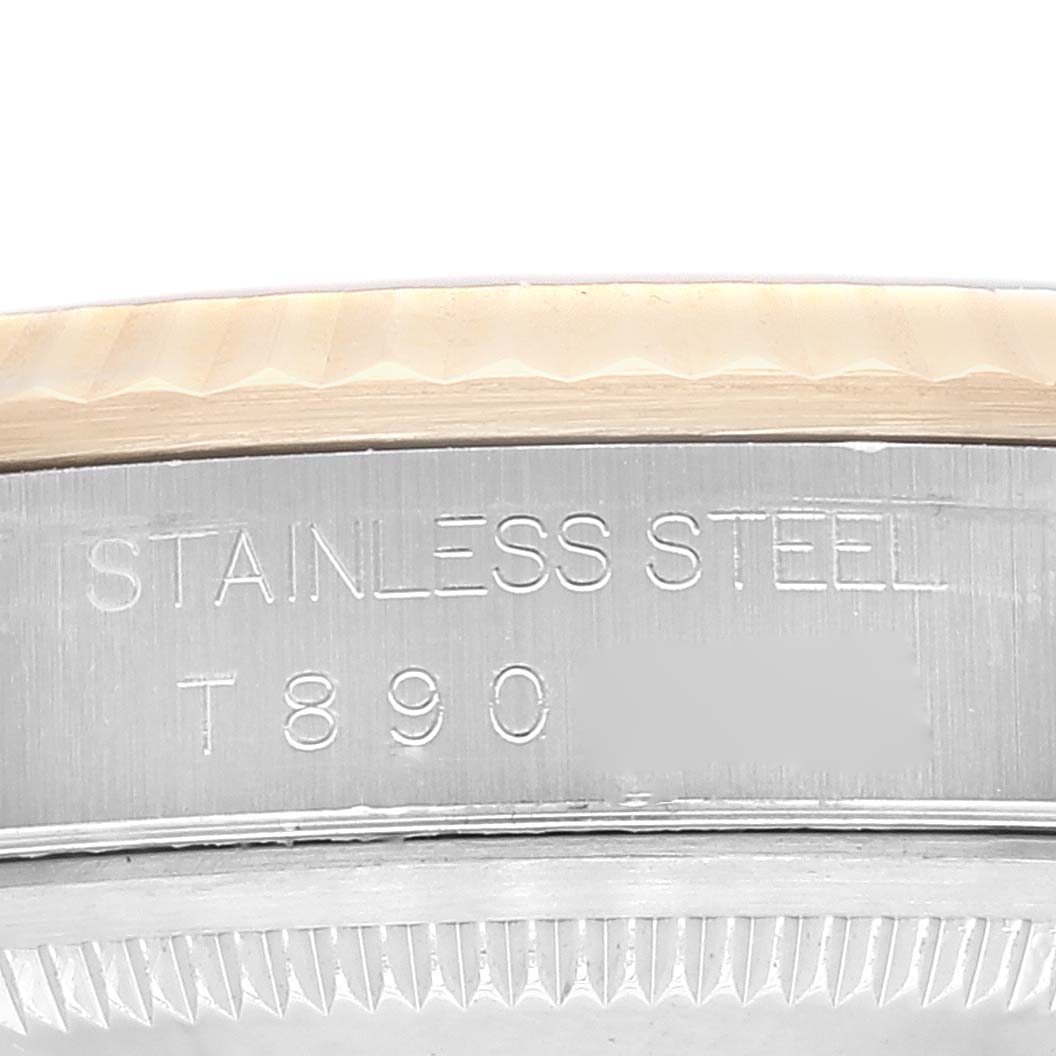 The image shows a close-up of the casing and bezel of a Rolex Datejust 16233 Men's Steel and Gold (two tone) Black Dial 16233 Men's Steel and Gold (two tone) Black Dial watch, focusing on the stainless steel material and model number engravings.