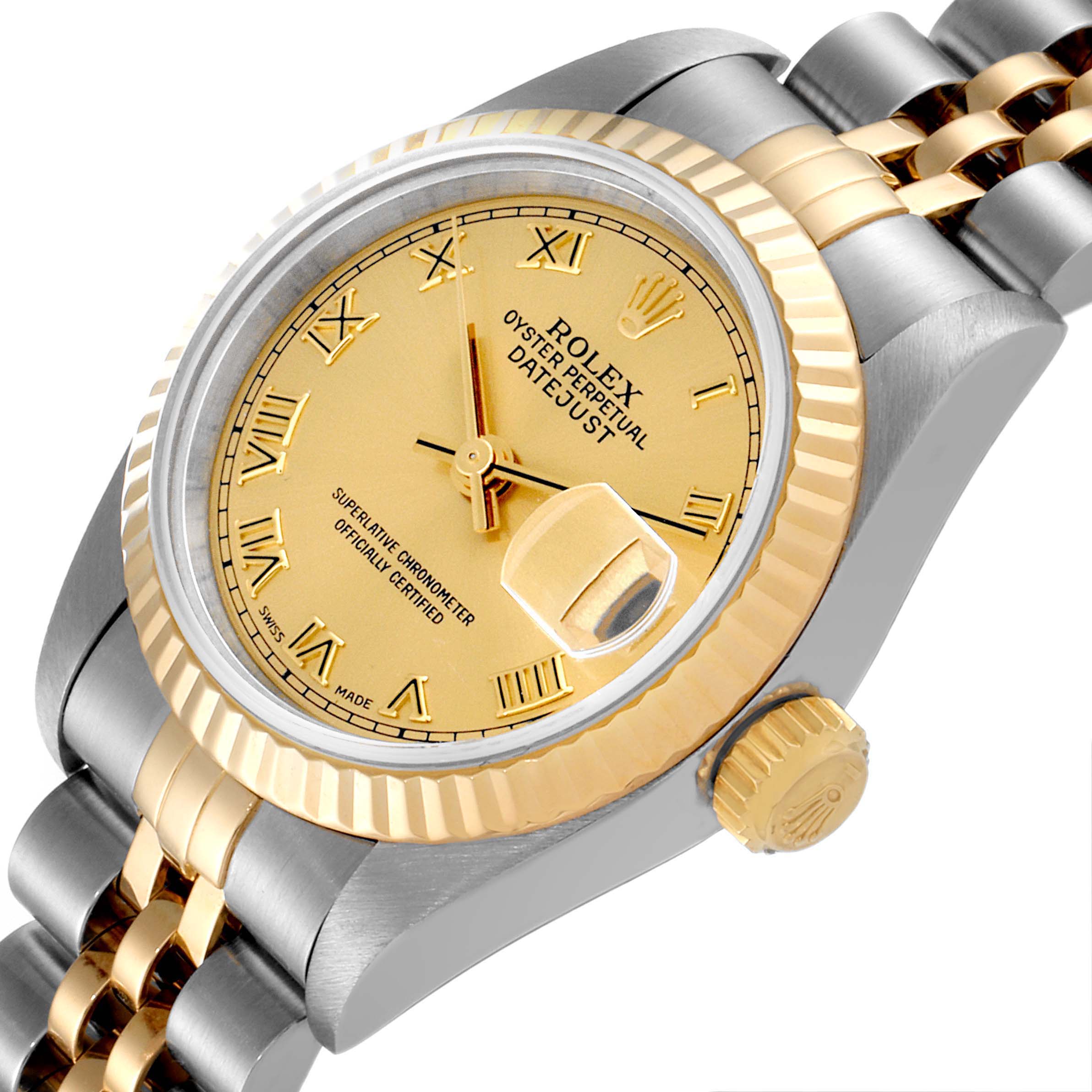 This Rolex Datejust 69173 Women
s Steel and Gold (two tone) Champagne Dial 69173 Women
s Steel and Gold (two tone) Champagne Dial watch is shown from a tilted angle, featuring the dial, crown, and part of the bracelet.
