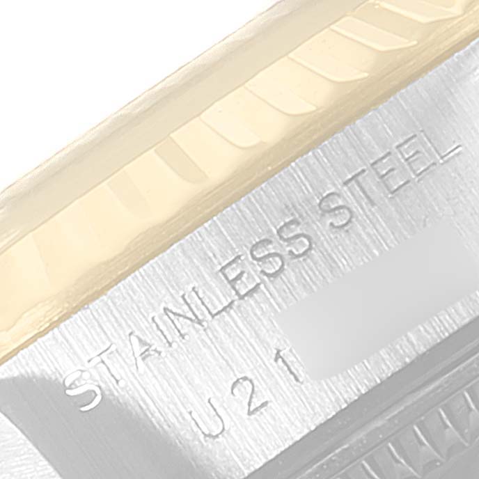 This close-up image shows the side view of a Rolex Datejust 69173 Women
s Steel and Gold (two tone) Champagne Dial 69173 Women
s Steel and Gold (two tone) Champagne Dial, highlighting its stainless steel surface and partial reference number.