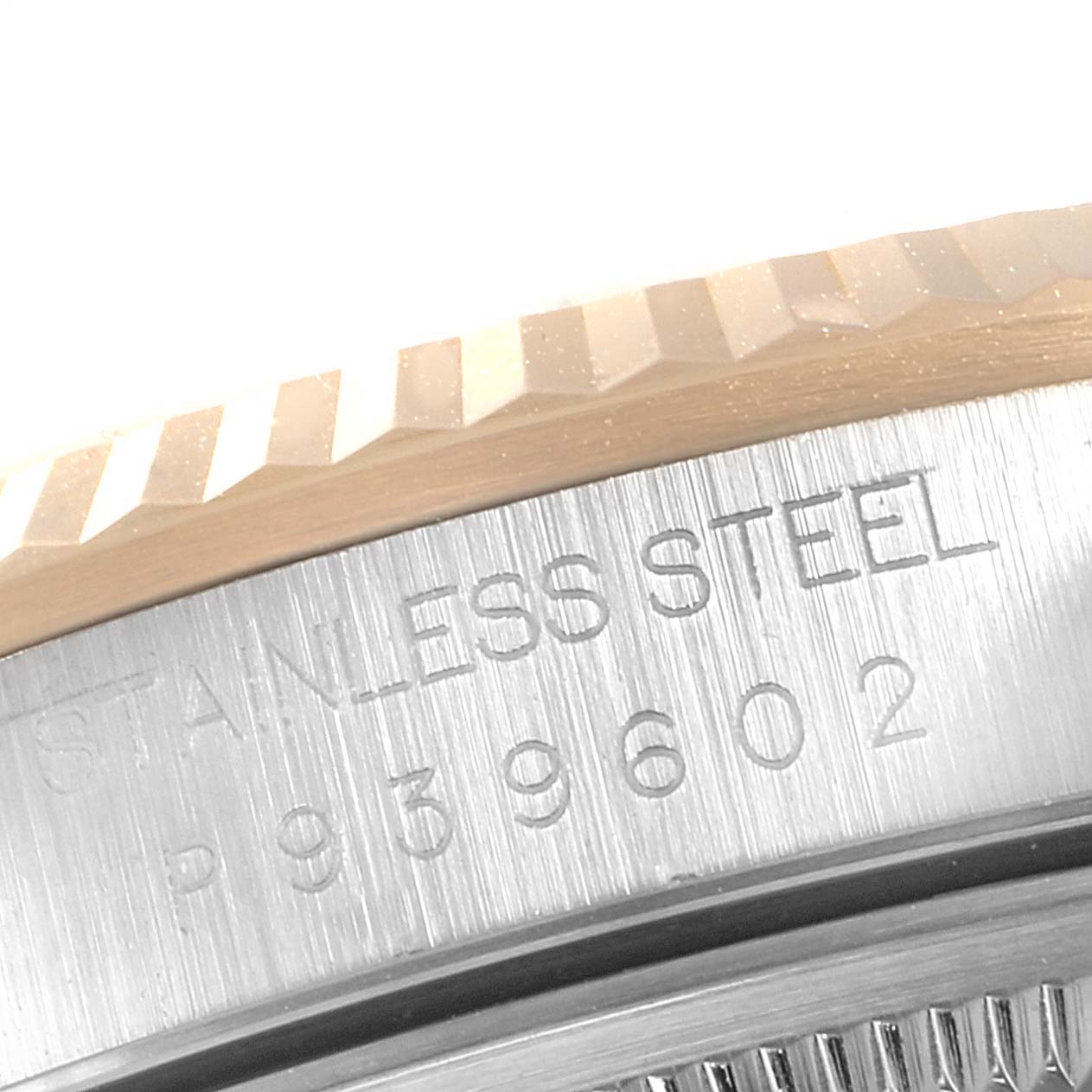 This image shows a close-up of the brushed stainless steel case and fluted bezel of a Rolex Datejust 16233 Men
s Steel and Gold (two tone) Mother of Pearl Dial 16233 Men
s Steel and Gold (two tone) Mother of Pearl Dial watch.