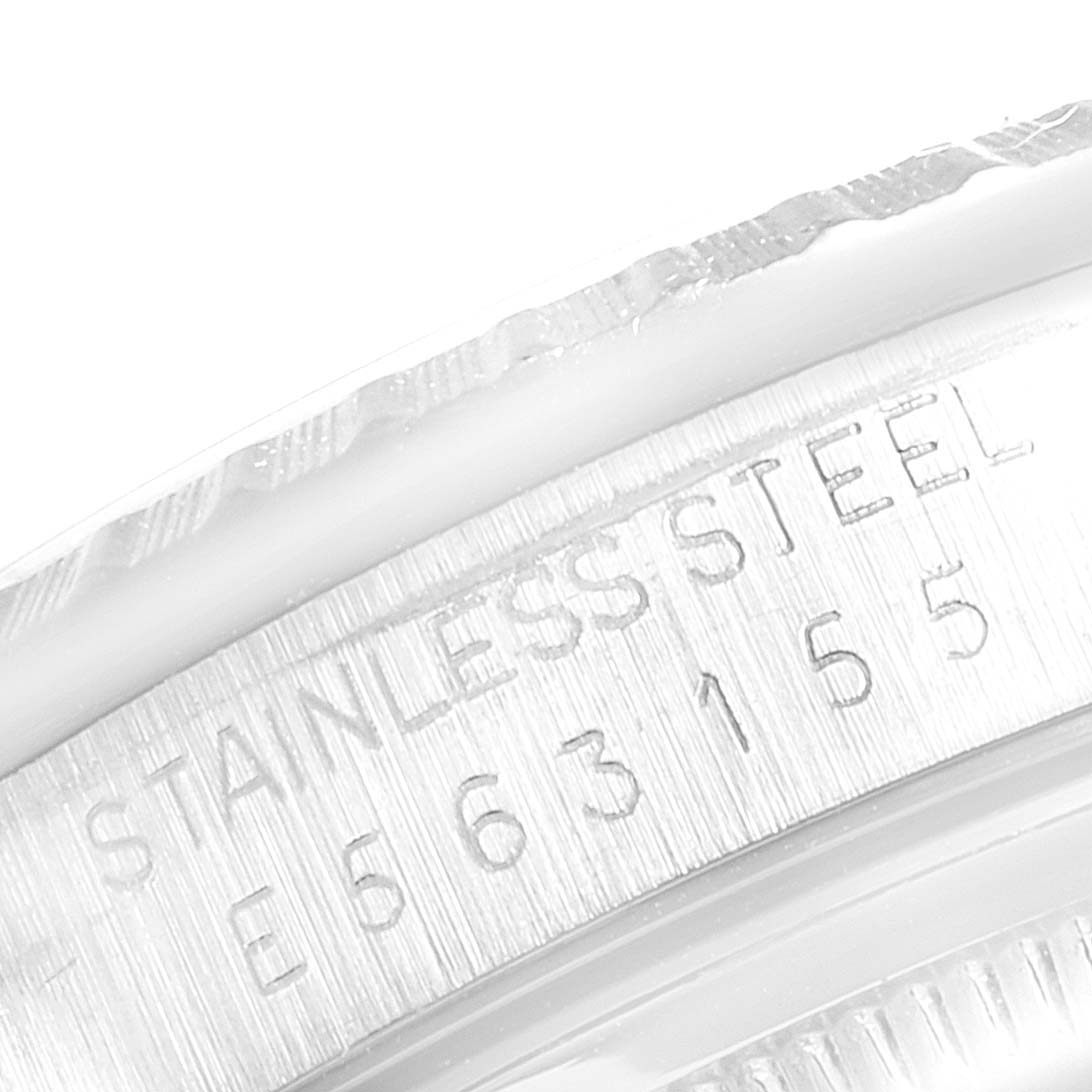 This image shows a close-up of the case and serial number engraving on a Rolex Datejust 16220 Men's Stainless Steel White Dial 16220 Men's Stainless Steel White Dial model.