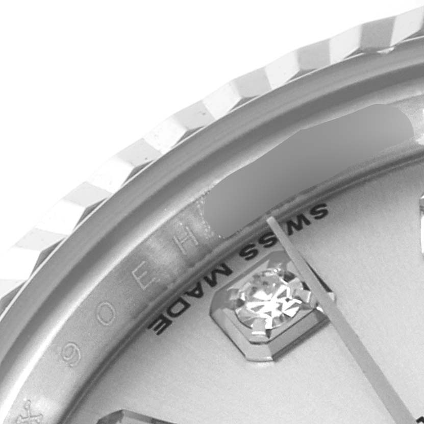 The image shows a close-up of the Rolex Datejust 179174 Women's Stainless Steel Silver Dial 179174 Women's Stainless Steel Silver Dial watch bezel, dial edge, and partial indices.