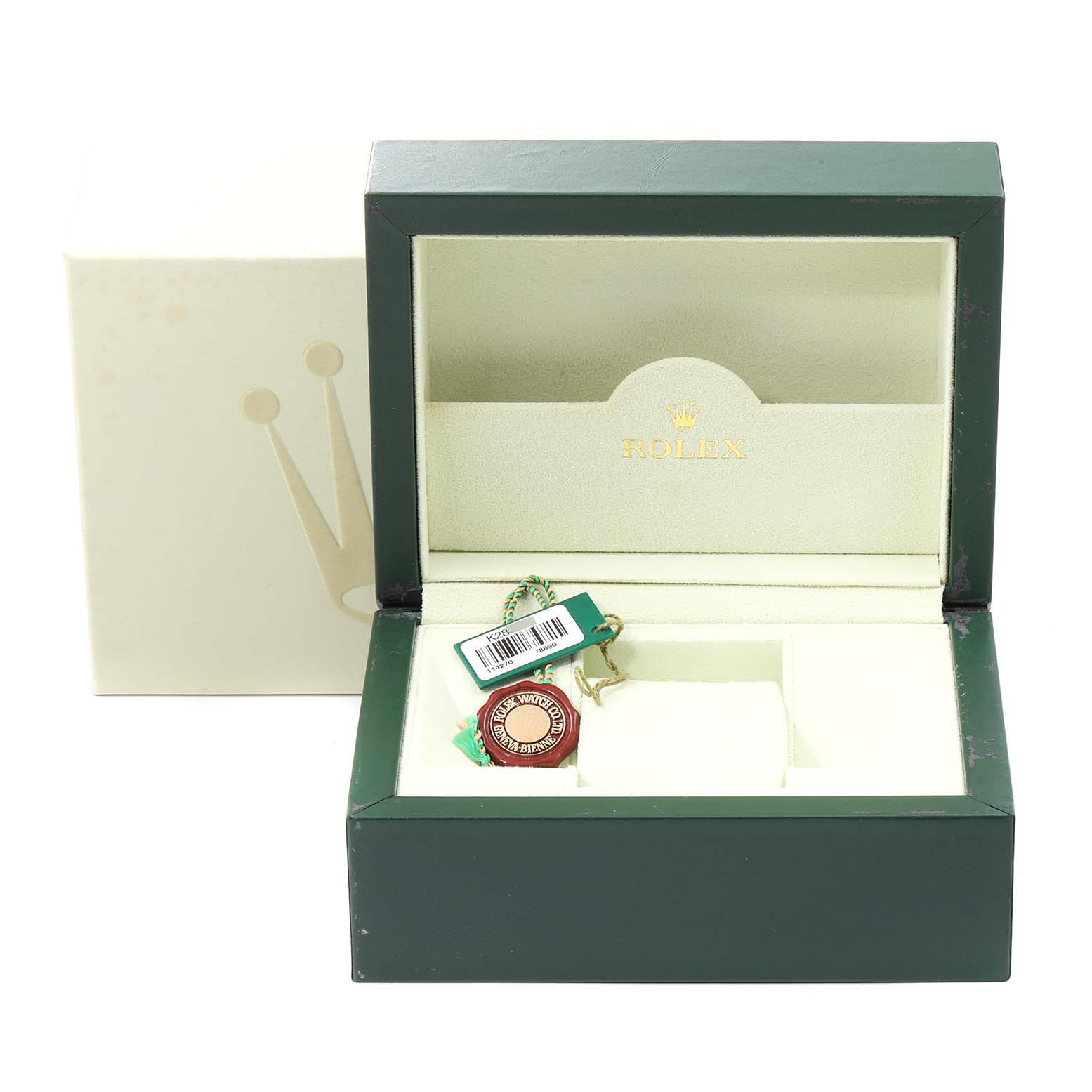 The image shows the open green and cream box for a Rolex Explorer 114270 Men
s Stainless Steel Black Dial 114270 Men
s Stainless Steel Black Dial watch with tags inside.