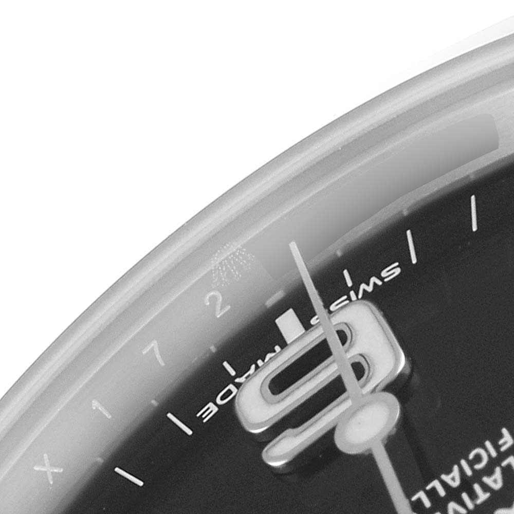 The image shows a close-up of the dial and hands of a Rolex Explorer 214270 Men's Stainless Steel Black Dial 214270 Men's Stainless Steel Black Dial watch, focusing on the "Swiss Made" text and the 9 o'clock marker.