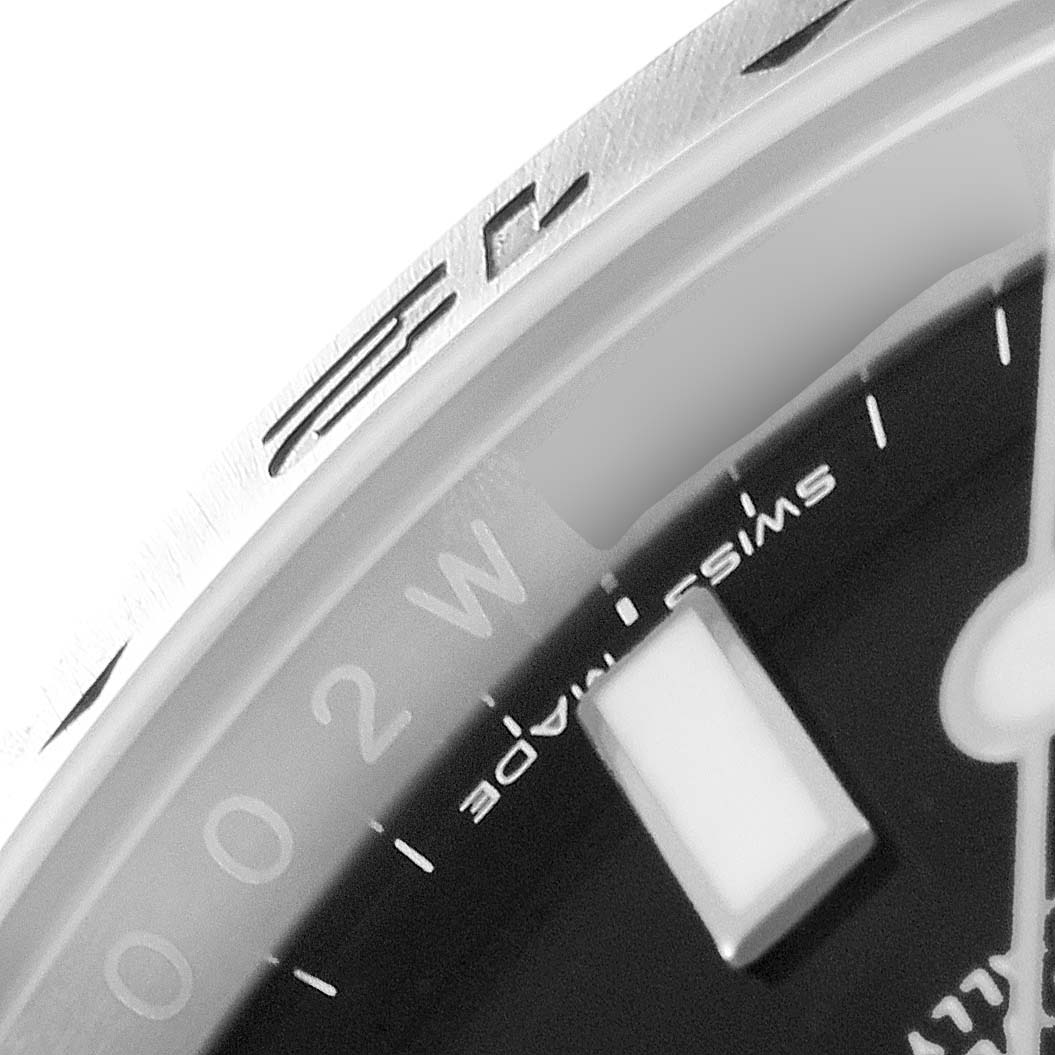 This close-up angle shows the dial, bezel, and an hour marker of the Rolex Explorer 216570 Men
s Stainless Steel Black Dial 216570 Men
s Stainless Steel Black Dial watch.