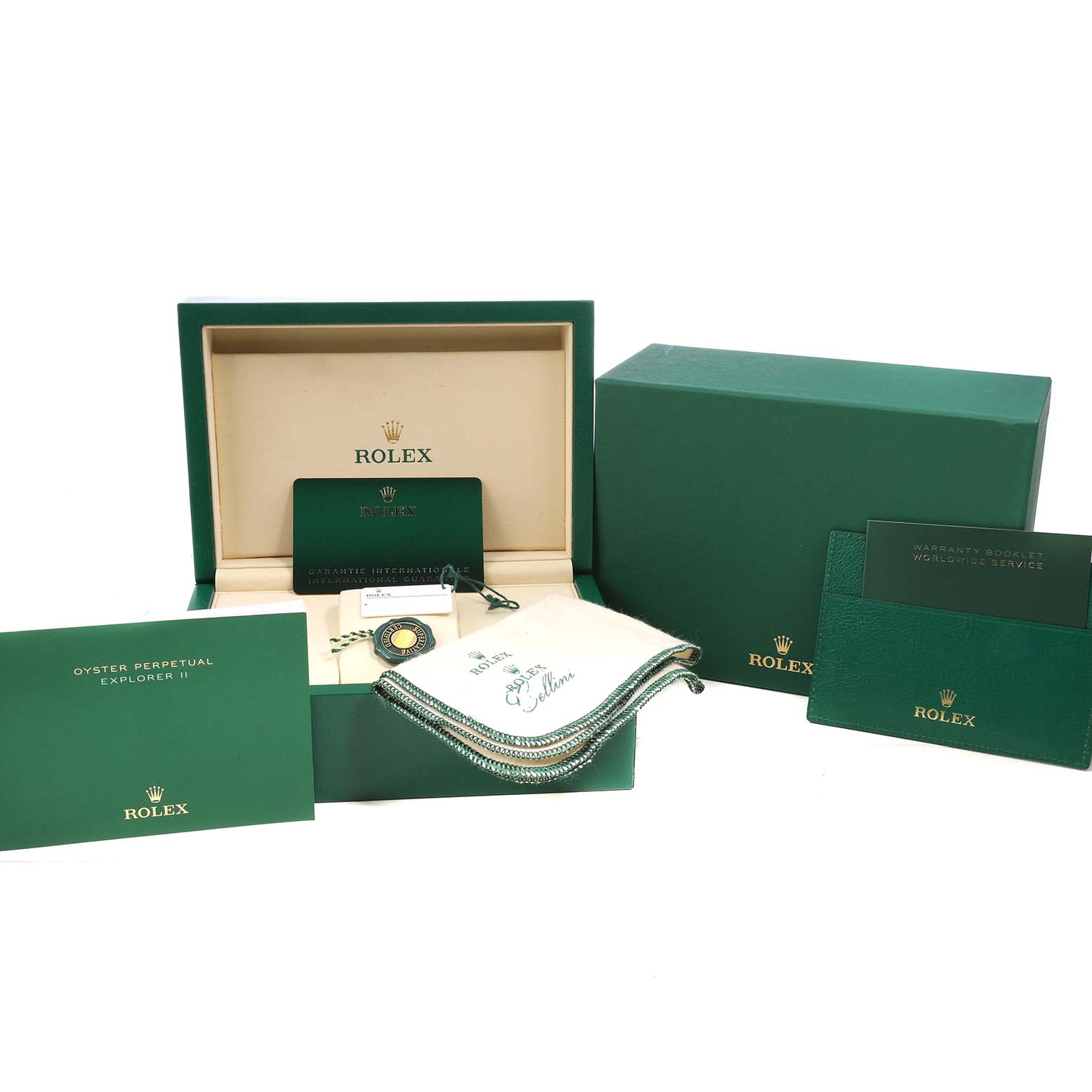 The image shows the packaging and accessories for the Rolex Explorer 226570 Men's Stainless Steel White Dial, including boxes, tags, booklets, and a cleaning cloth.