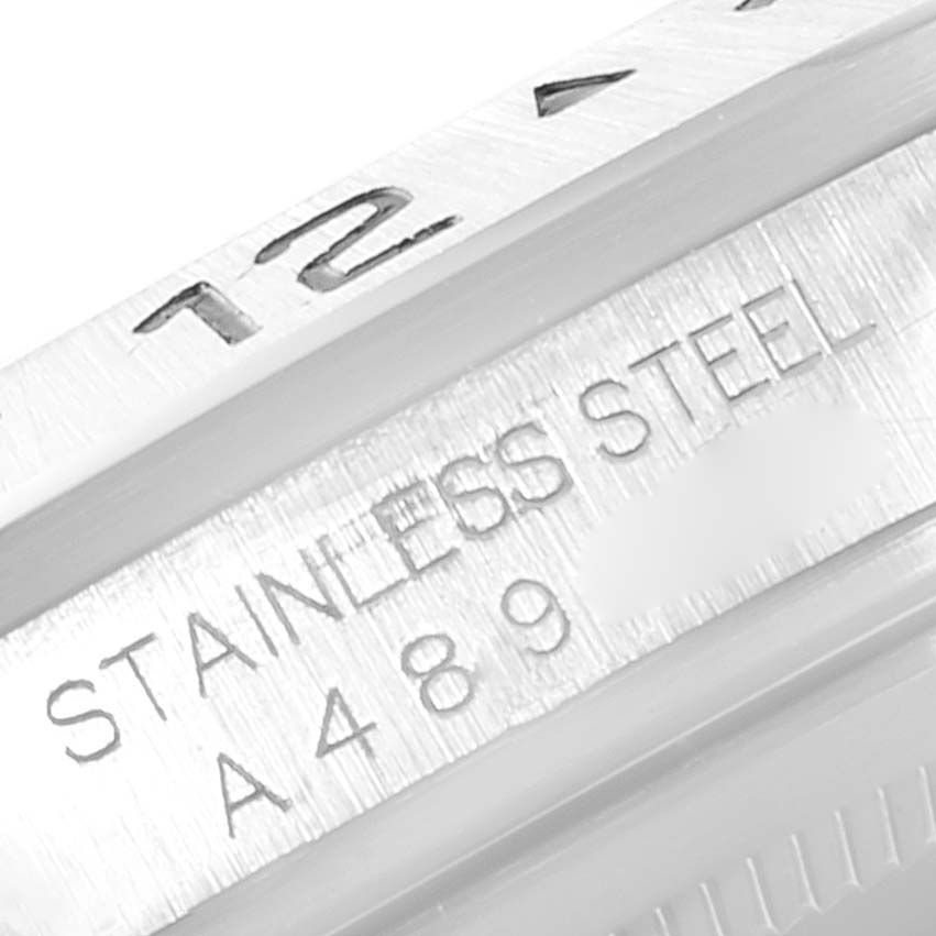 The image shows a close-up of the engraving on the stainless steel casing of a Rolex Explorer 16570 Men
s Stainless Steel Black Dial 16570 Men
s Stainless Steel Black Dial watch.