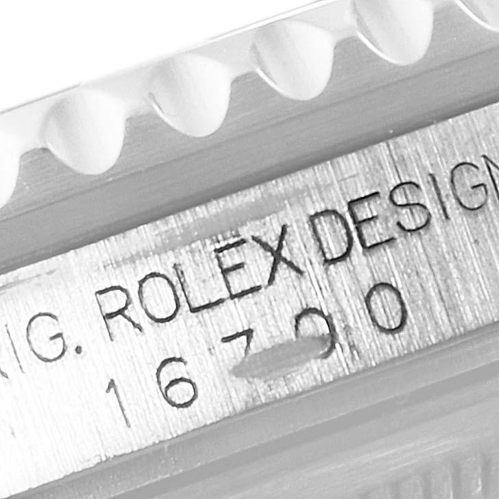 This close-up image shows the side engraving and bezel of a Rolex GMT-Master 16700 Men
s Stainless Steel Black Dial 16700 Men
s Stainless Steel Black Dial model.