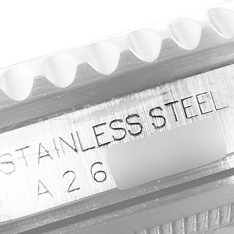 This image shows a close-up view of the stainless steel case side and part of the serrated bezel edge on a Rolex GMT-Master 16700 Men
s Stainless Steel Black Dial 16700 Men
s Stainless Steel Black Dial watch.