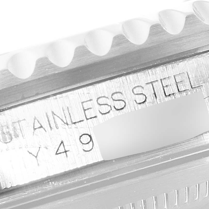 The image shows a close-up of the engraving on the stainless steel case of a Rolex GMT-Master 16710 Men
s Stainless Steel Black Dial 16710 Men
s Stainless Steel Black Dial watch.