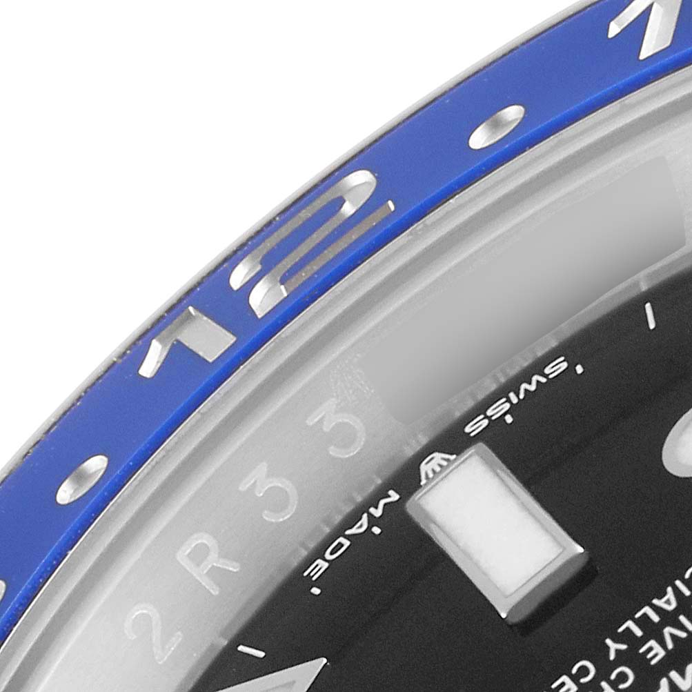 This image shows a close-up of the bezel and part of the dial of a Rolex GMT-Master 126710 Men
s Stainless Steel Black Dial 126710 Men
s Stainless Steel Black Dial watch.