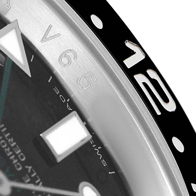 The image shows a close-up of the dial and bezel of a Rolex GMT-Master 116710 Men's Stainless Steel Black Dial, highlighting the hour markers and bezel numbers.
