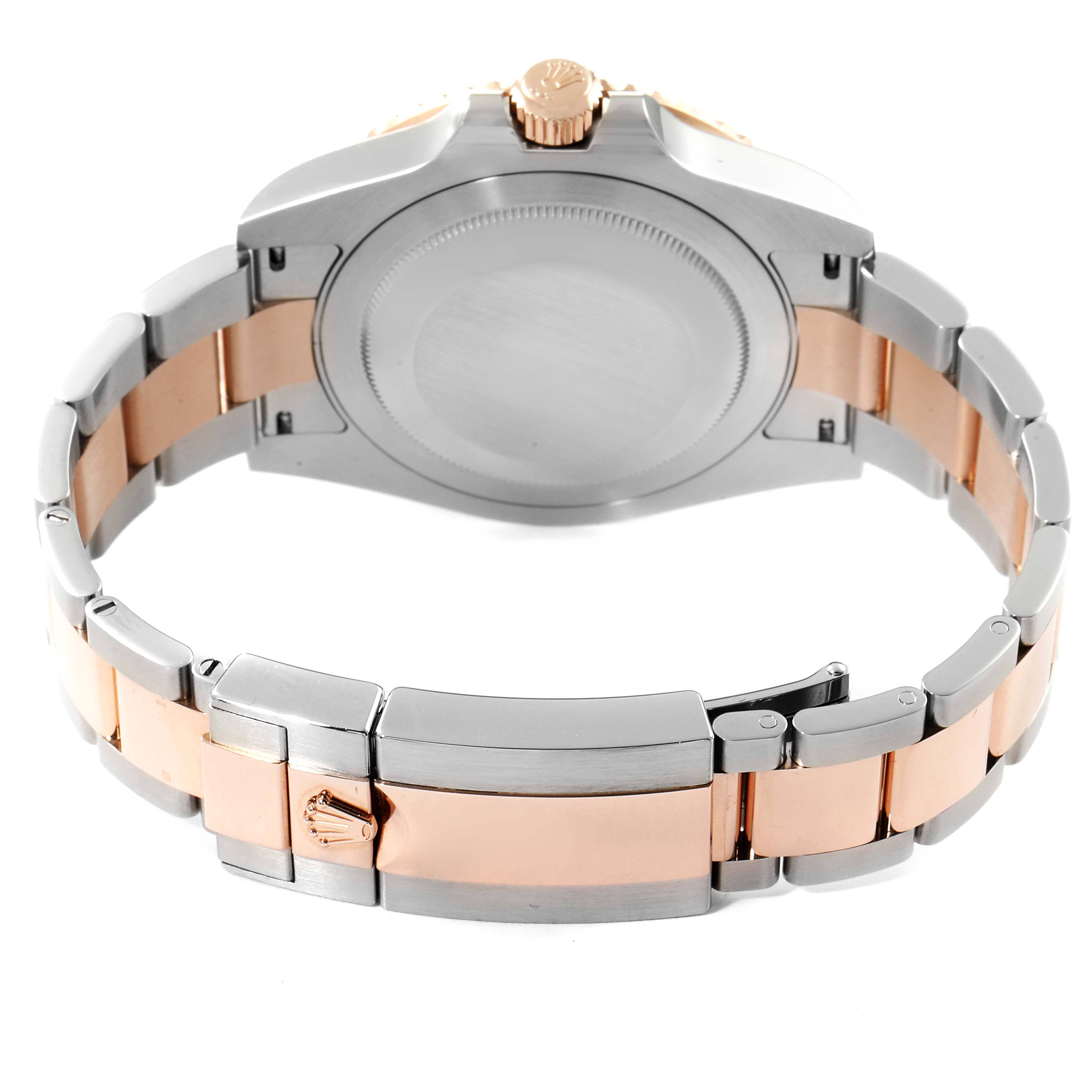 The image shows the back view of a Rolex GMT-Master 126711 Men's Steel and Gold (two tone) Black Dial 126711 Men's Steel and Gold (two tone) Black Dial watch emphasizing the clasp and part of the bracelet.