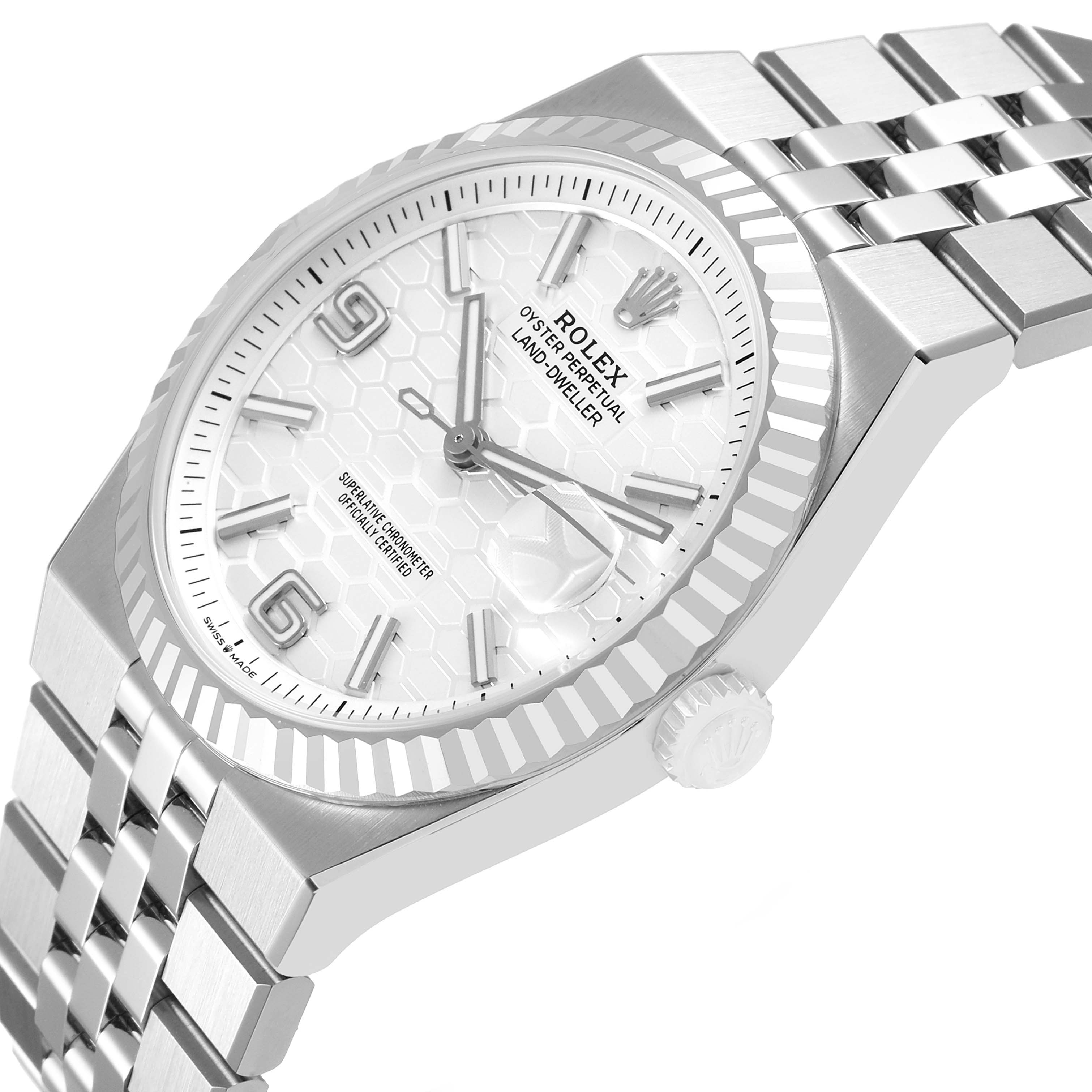 The Rolex Land-Dweller watch is shown at an angled top view, highlighting the bezel, dial, and bracelet.