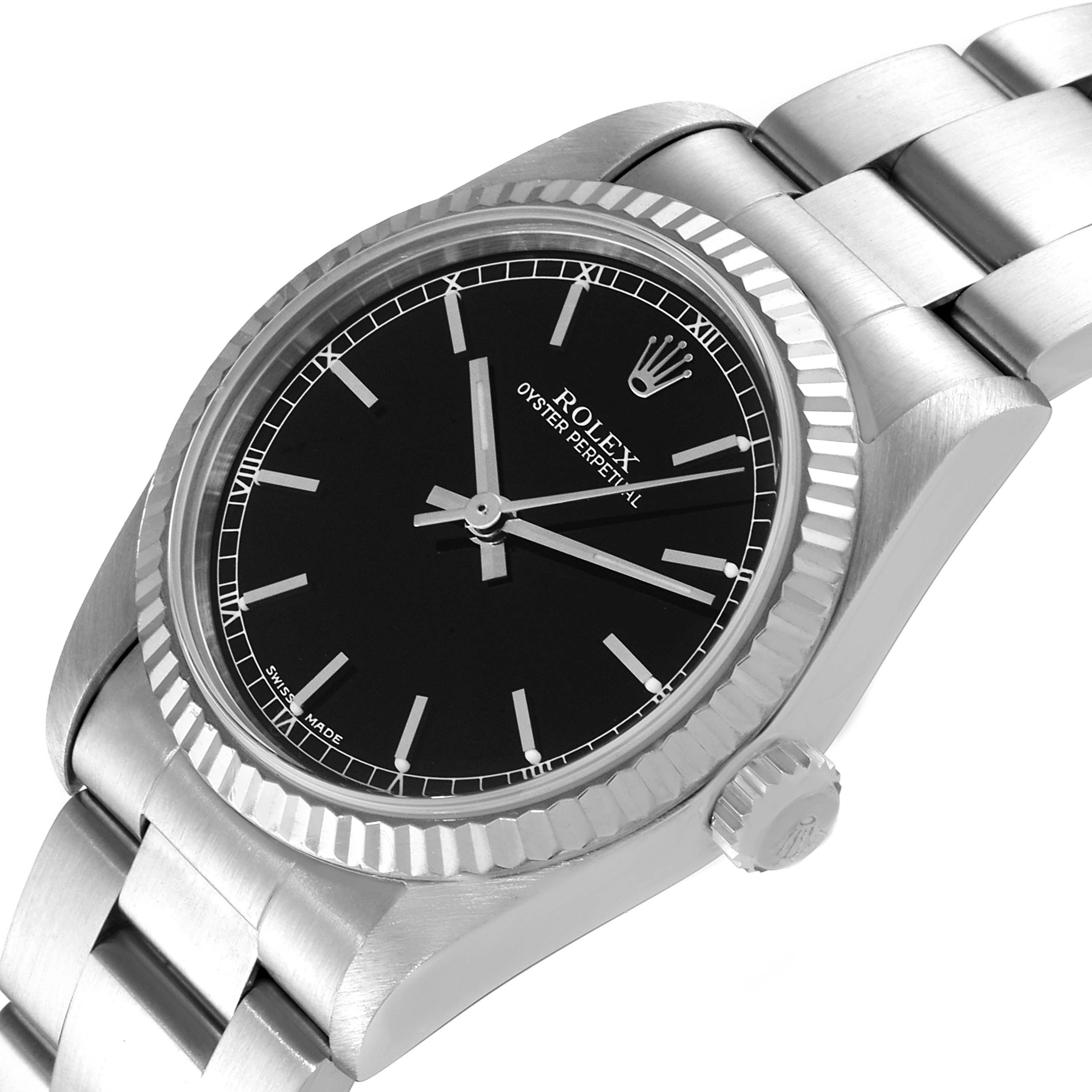 The image shows an angled view of a Rolex Oyster Perpetual Mid-Size watch, highlighting its black dial, bezel, crown, and bracelet.