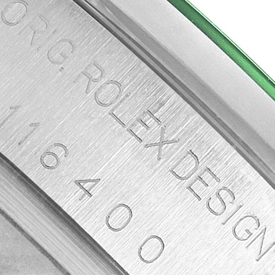 The close-up image shows the engraved side of the Rolex Milgauss 116400GV Men's Stainless Steel Black Dial model, highlighting "ROLEX DESIGN" and model number "116400".
