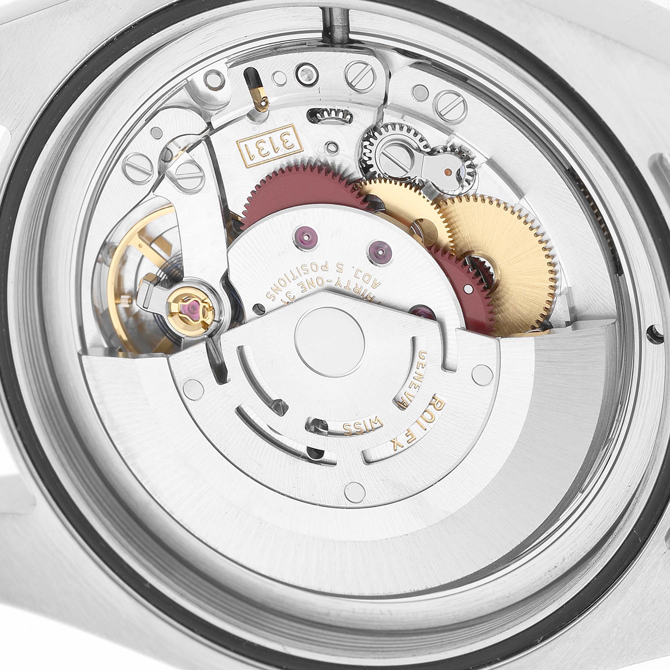 The image shows the internal movement mechanism of a Rolex Milgauss 116400GV Men's Stainless Steel Black Dial, highlighting gears and the rotor from a top view.