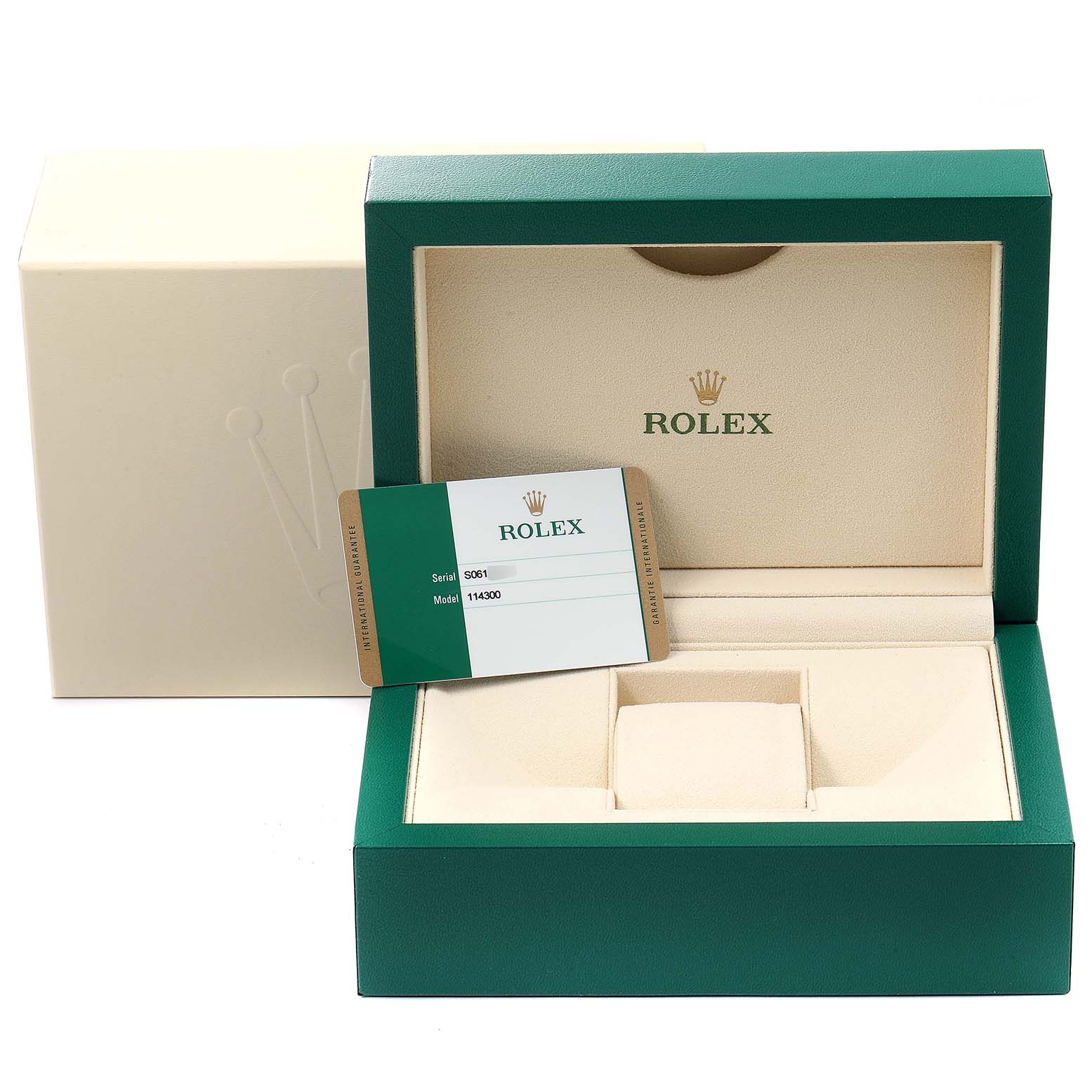The image shows the packaging and warranty card for a Rolex Oyster Perpetual 114300 Men's Stainless Steel Silver Dial 114300 Men's Stainless Steel Silver Dial model, with the box open and empty.